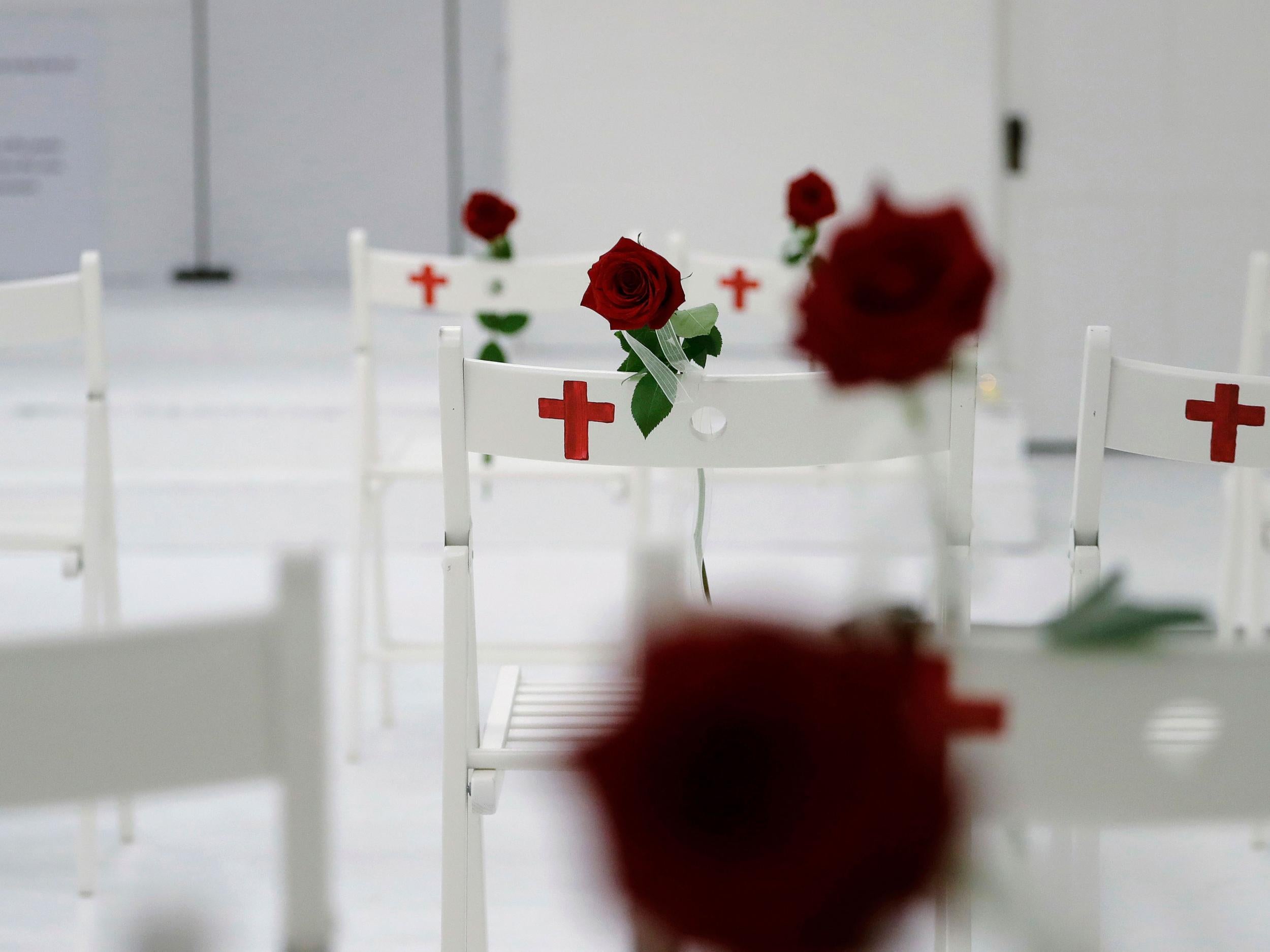 Each chair is also painted with a cross