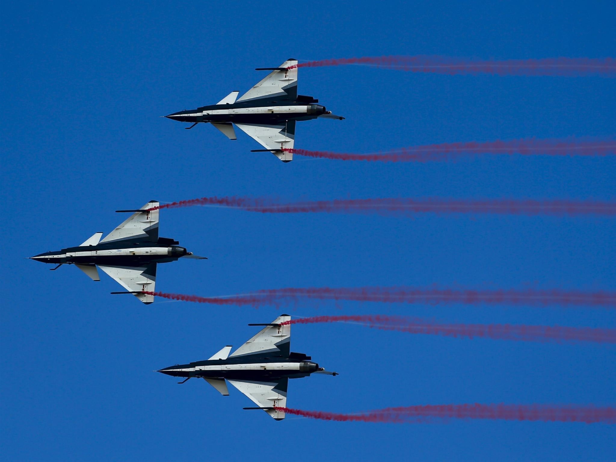 China's J-10 fighter jets from the People's Liberation Army Air Force August 1st Aerobatics Team perform during a media demonstration at the Korat Royal Thai Air Force Base, Nakhon Ratchasima province, Thailand, November 24, 2015