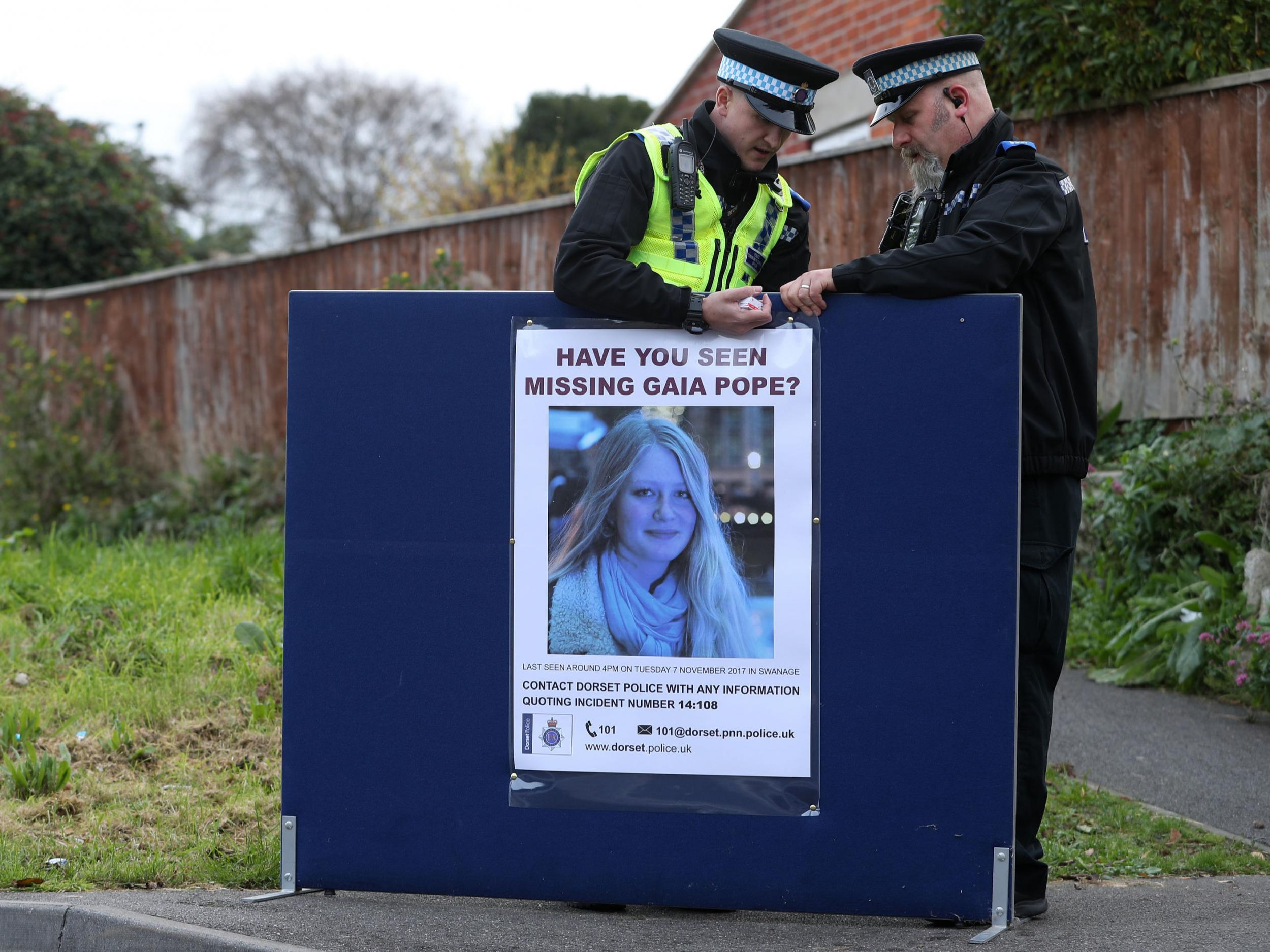 Police put up a missing person notice for Gaia Pope in Swanage, Dorset