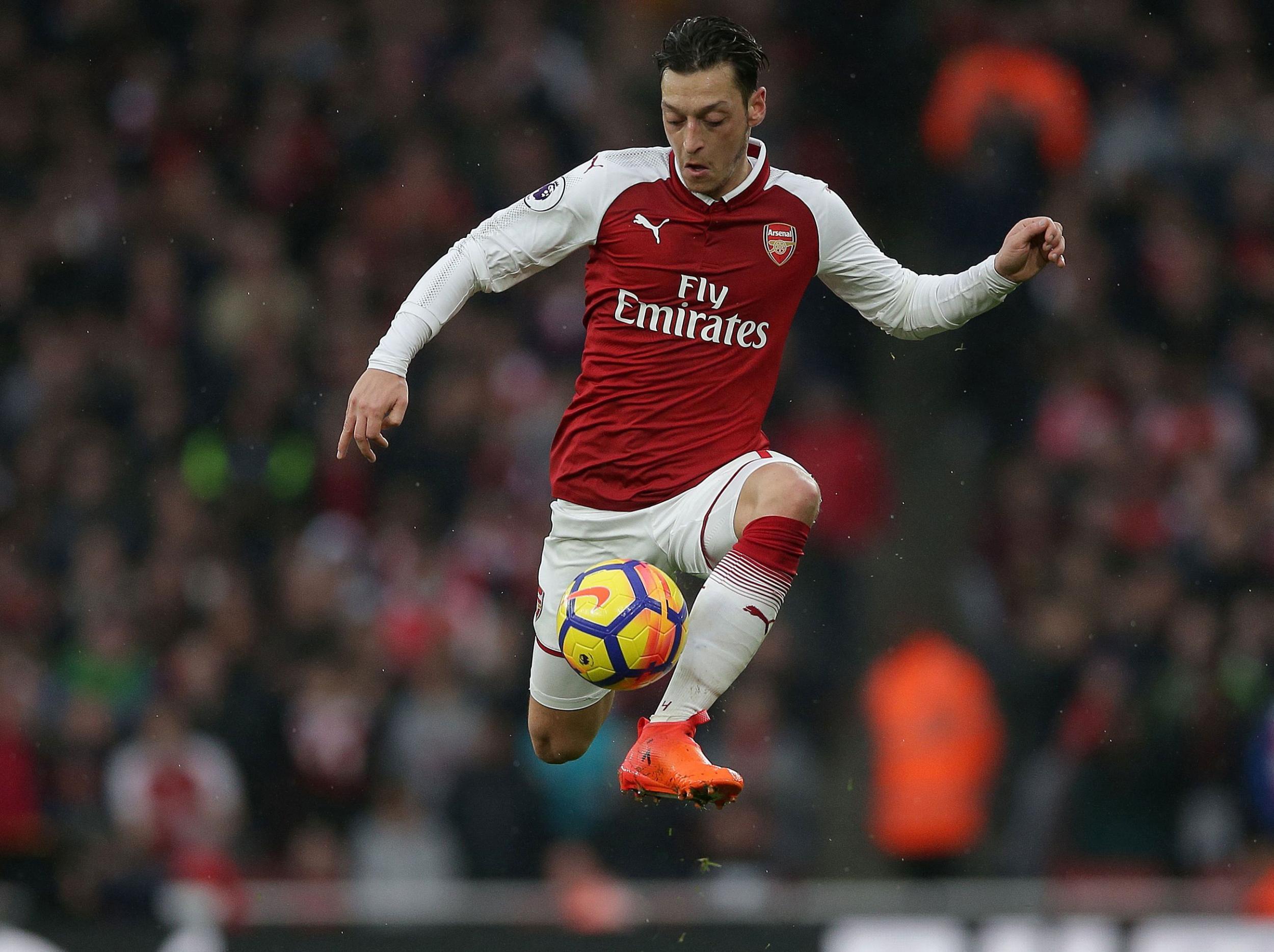 Mesut Ozil put on a masterclass as Arsenal beat their bitter rivals