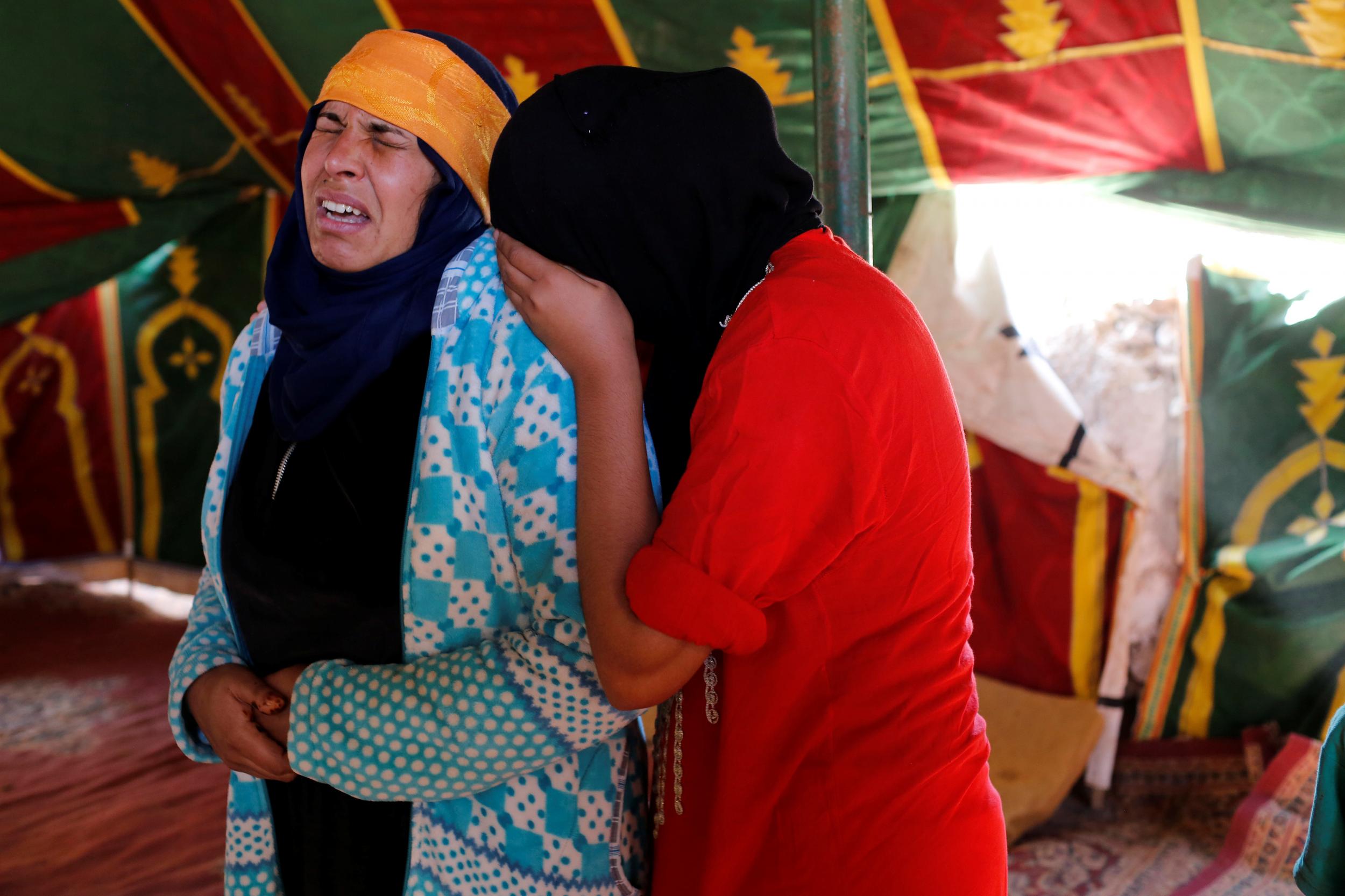 Relatives mourn the people killed when a stampede broke out in the southwestern town of Sidi Boulaalam on 20 November 2017