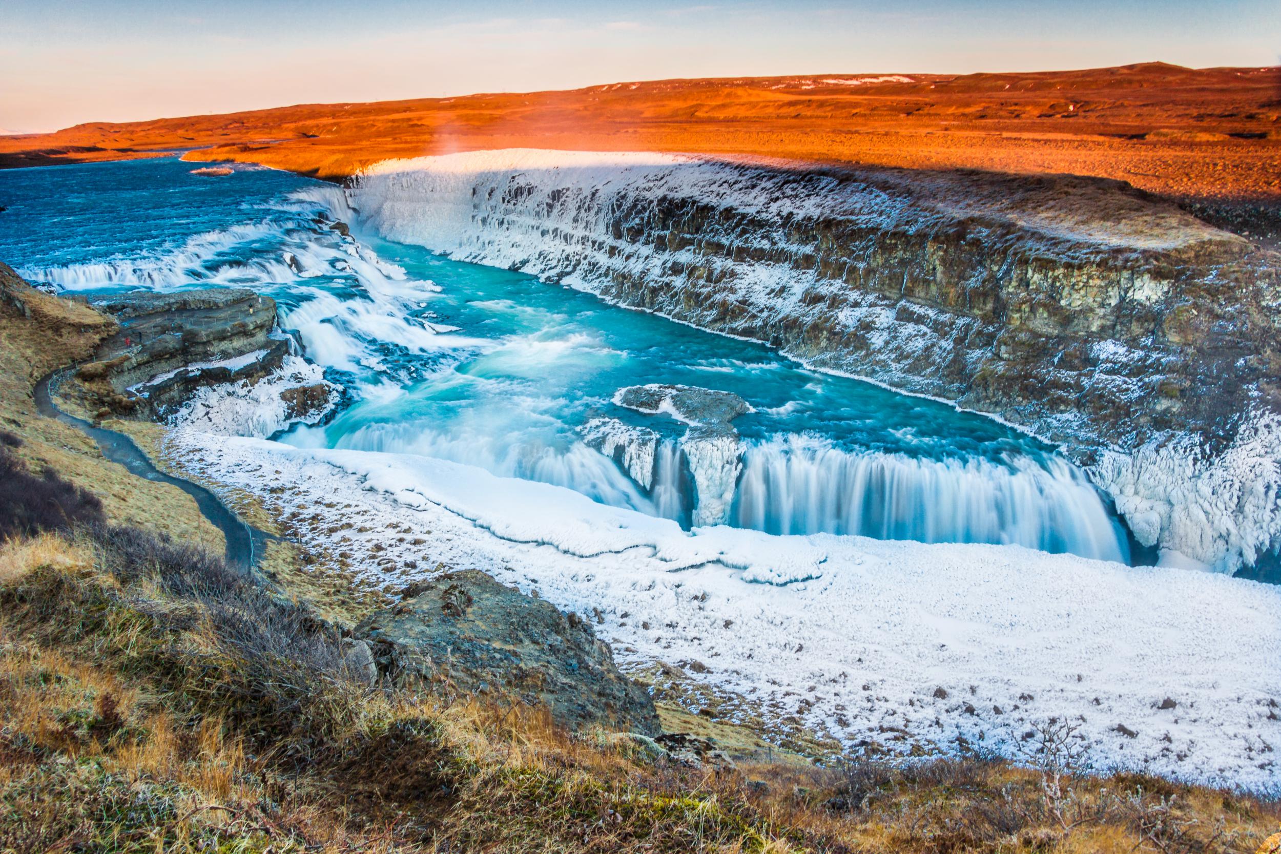 Amazing Icelandic winter landscape of majestic waterfall of frozen Gullfoss