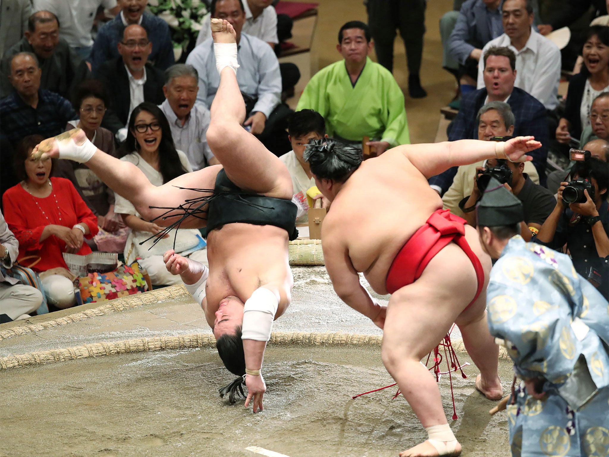 Yokozuna Haramafuji (left) is accused of violence towards a student