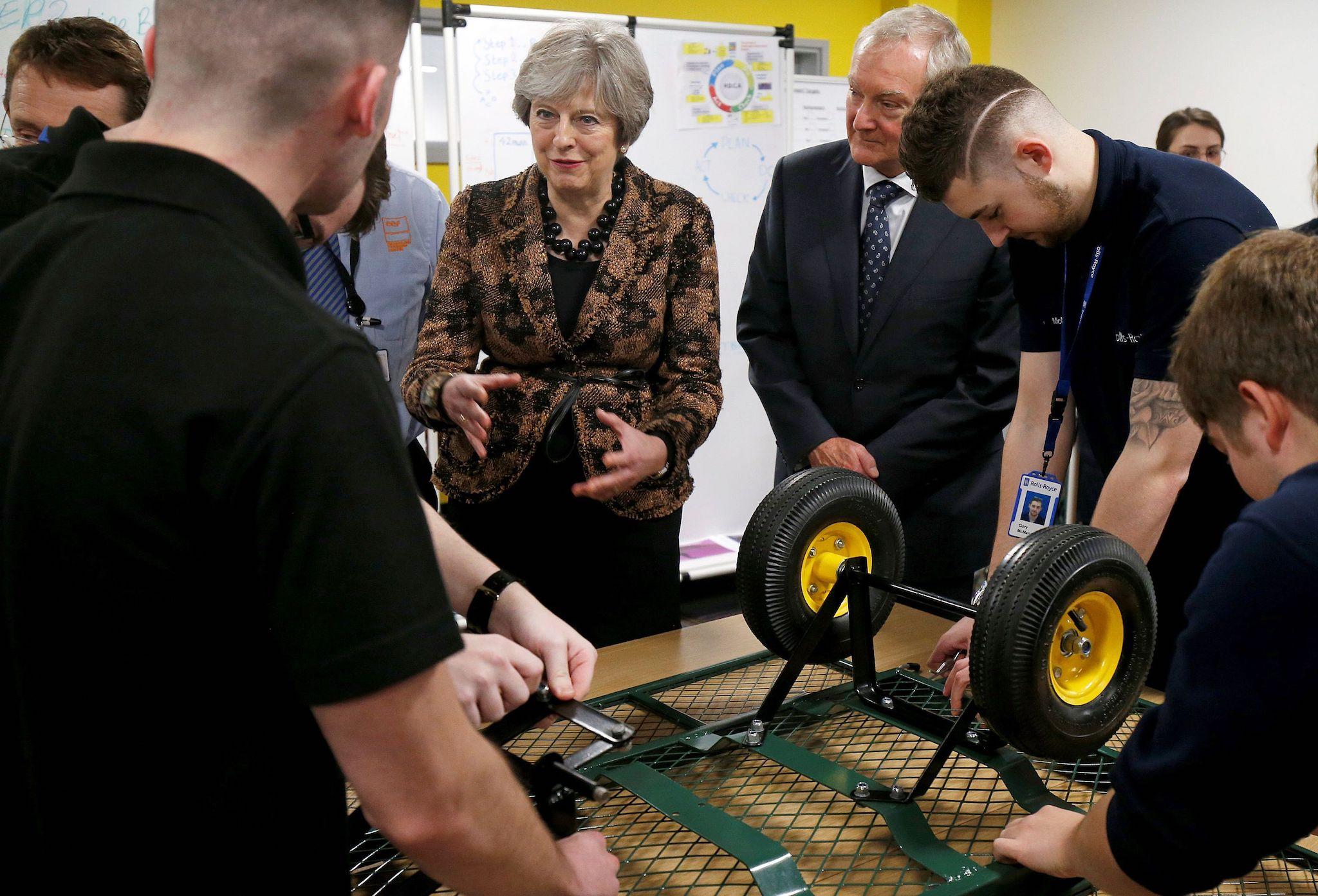 Britain's Prime Minister Theresa May visits an engineering training facility in Birmingham, central England, on November 20, 2017
