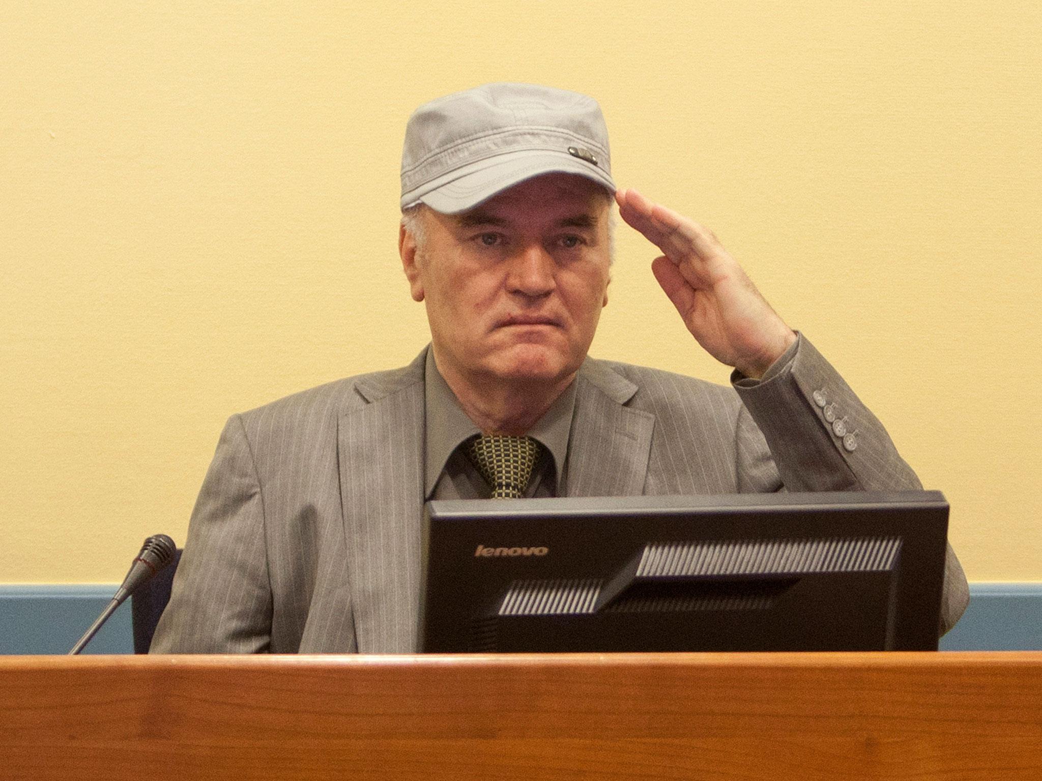 Ratko Mladic salutes as he makes his first appearance at the International Criminal Tribunal in 2011 at The Hague, Netherlands