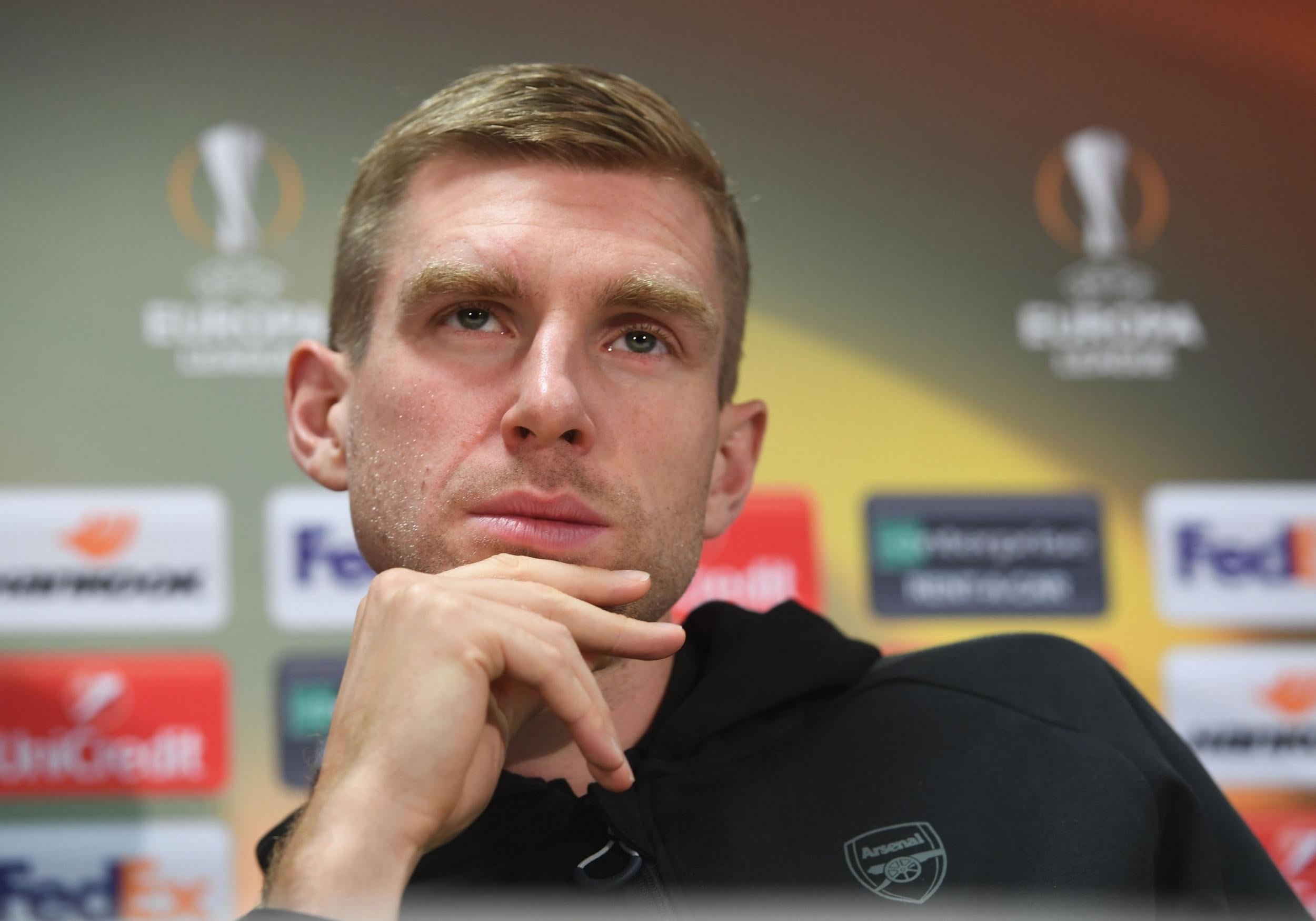 Per Mertesacker speaks to the media before the Europa League clash