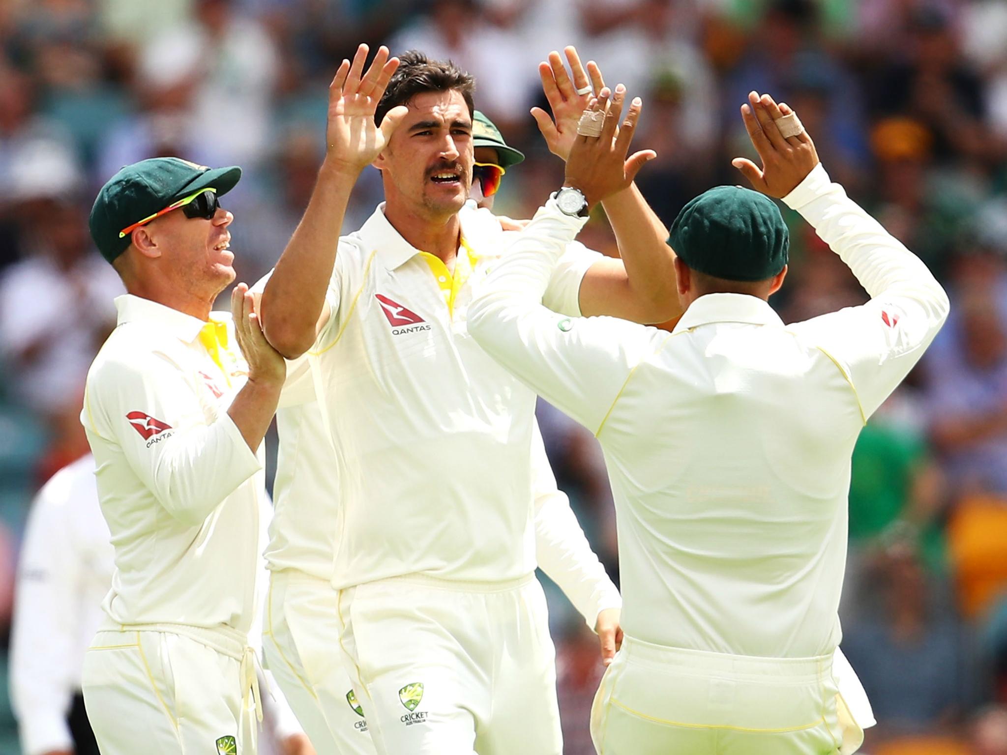 Starc celebrates having Cook caught at slip