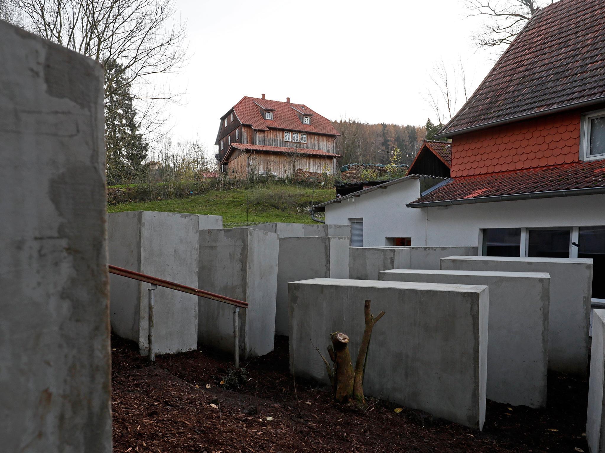 A replica of the Memorial to the Murdered Jews of Europe in Berlin, has been placed near a right wing politician's house (L)