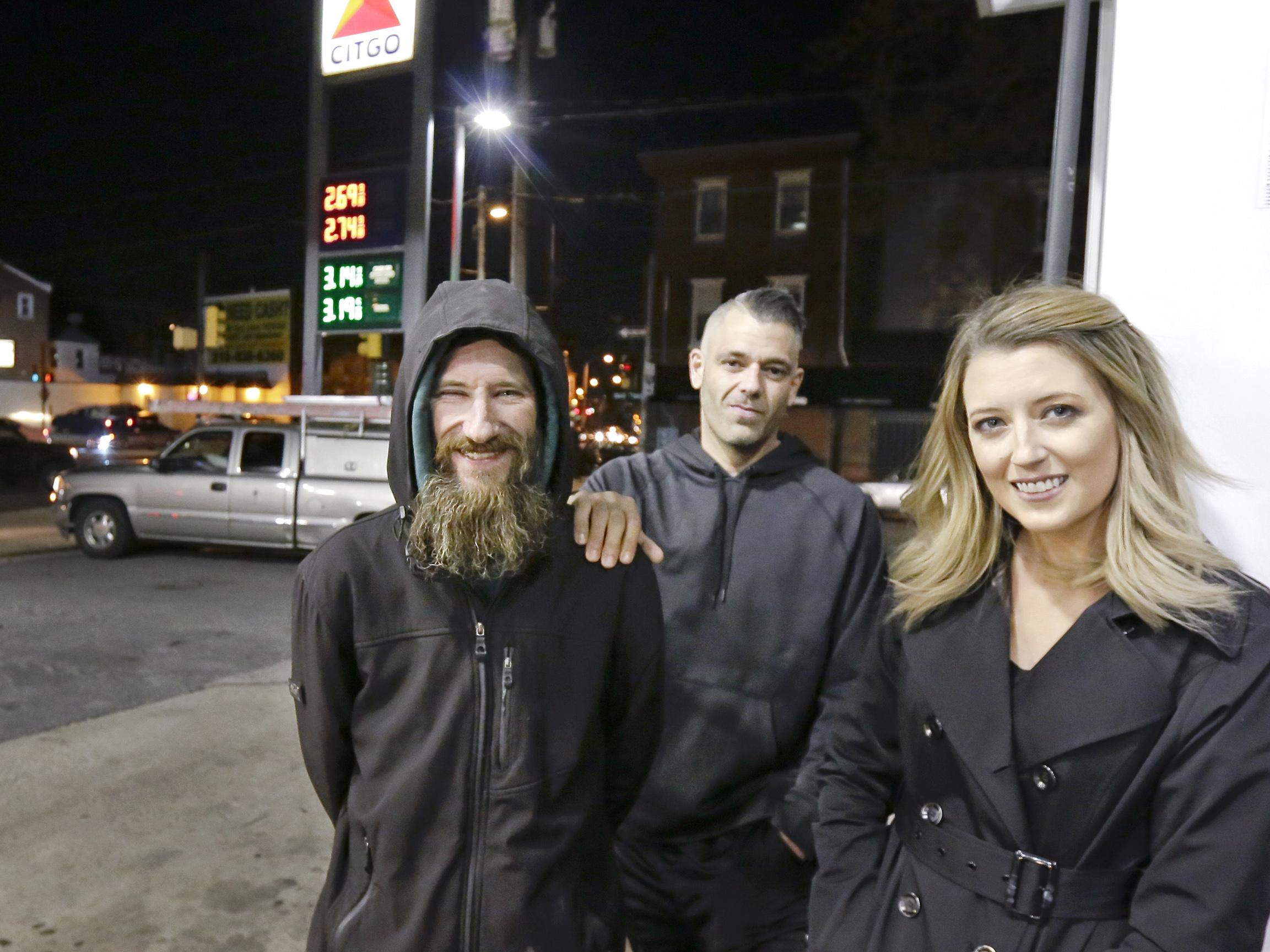 File photo: Johnny Bobbitt Jr, left, Kate McClure, right, and her boyfriend Mark D'Amico pose in Philadelphia