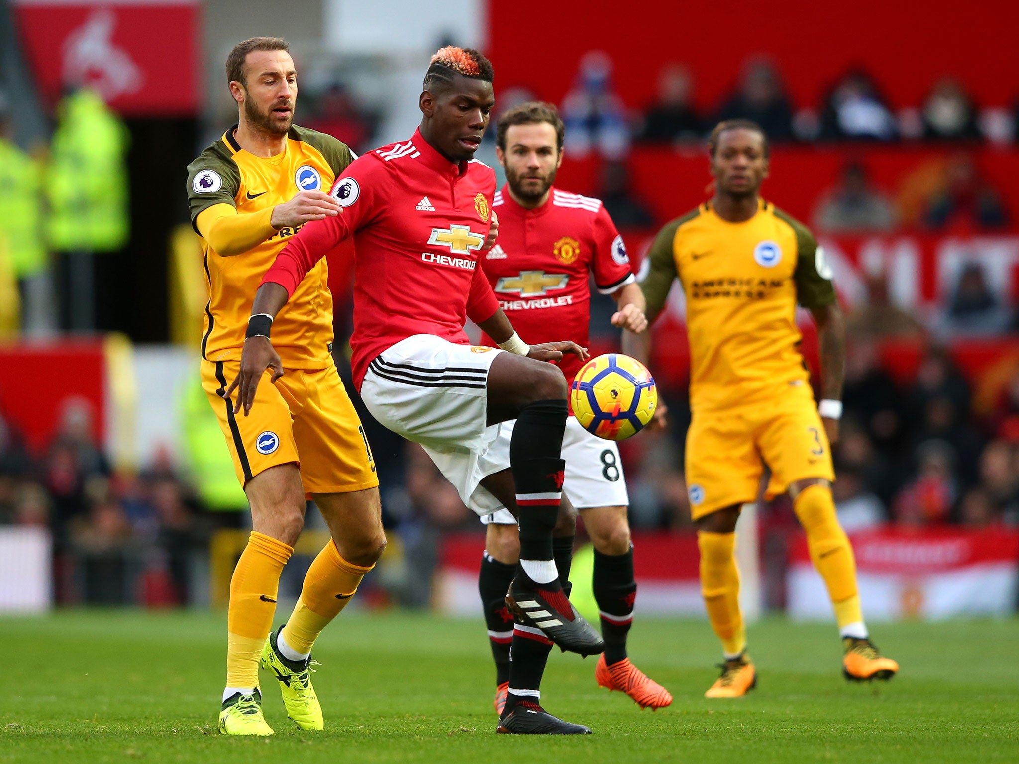 Glenn Murray applies pressure to Paul Pogba's first touch