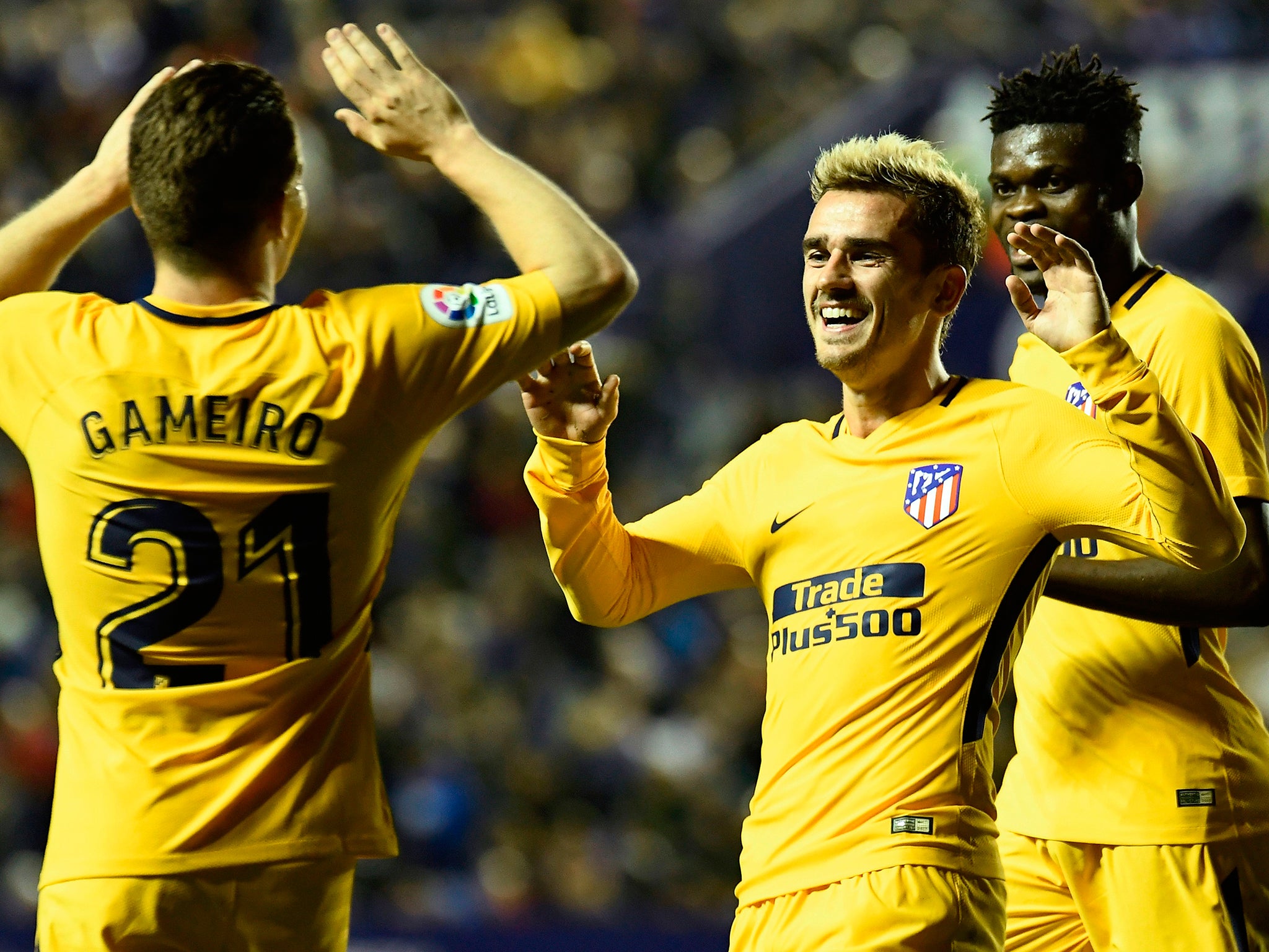 Antoine Griezmann celebrates with Kevin Gameiro after scoring for Atletico against Levante