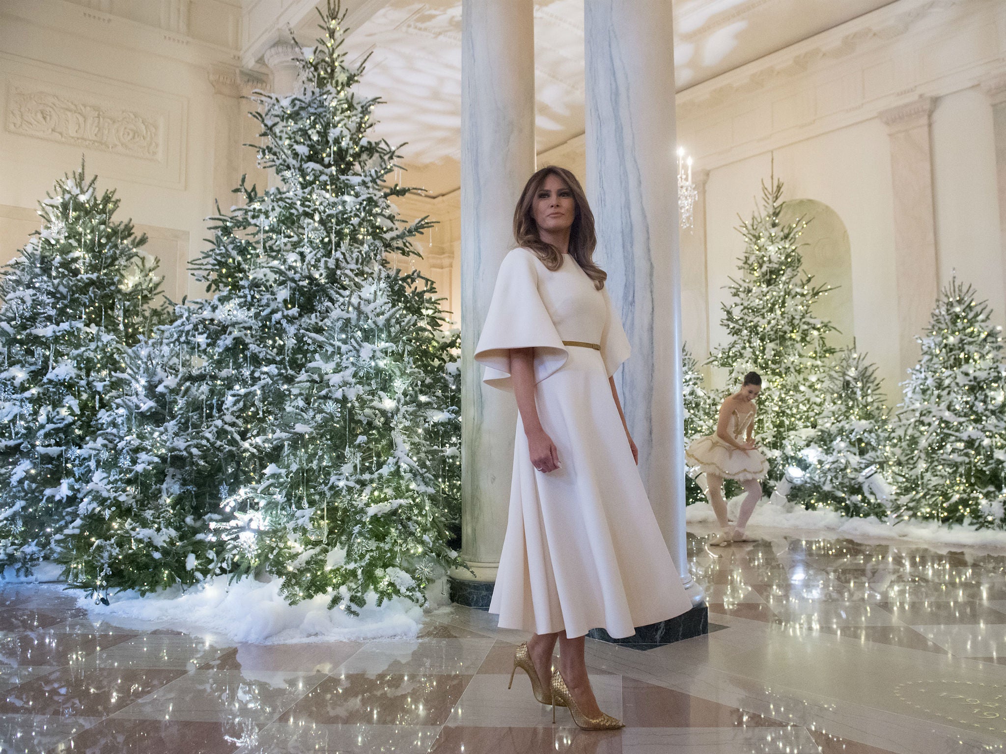 First Lady Melania Trump in the Grand Foyer of the White house as she tours the decorations