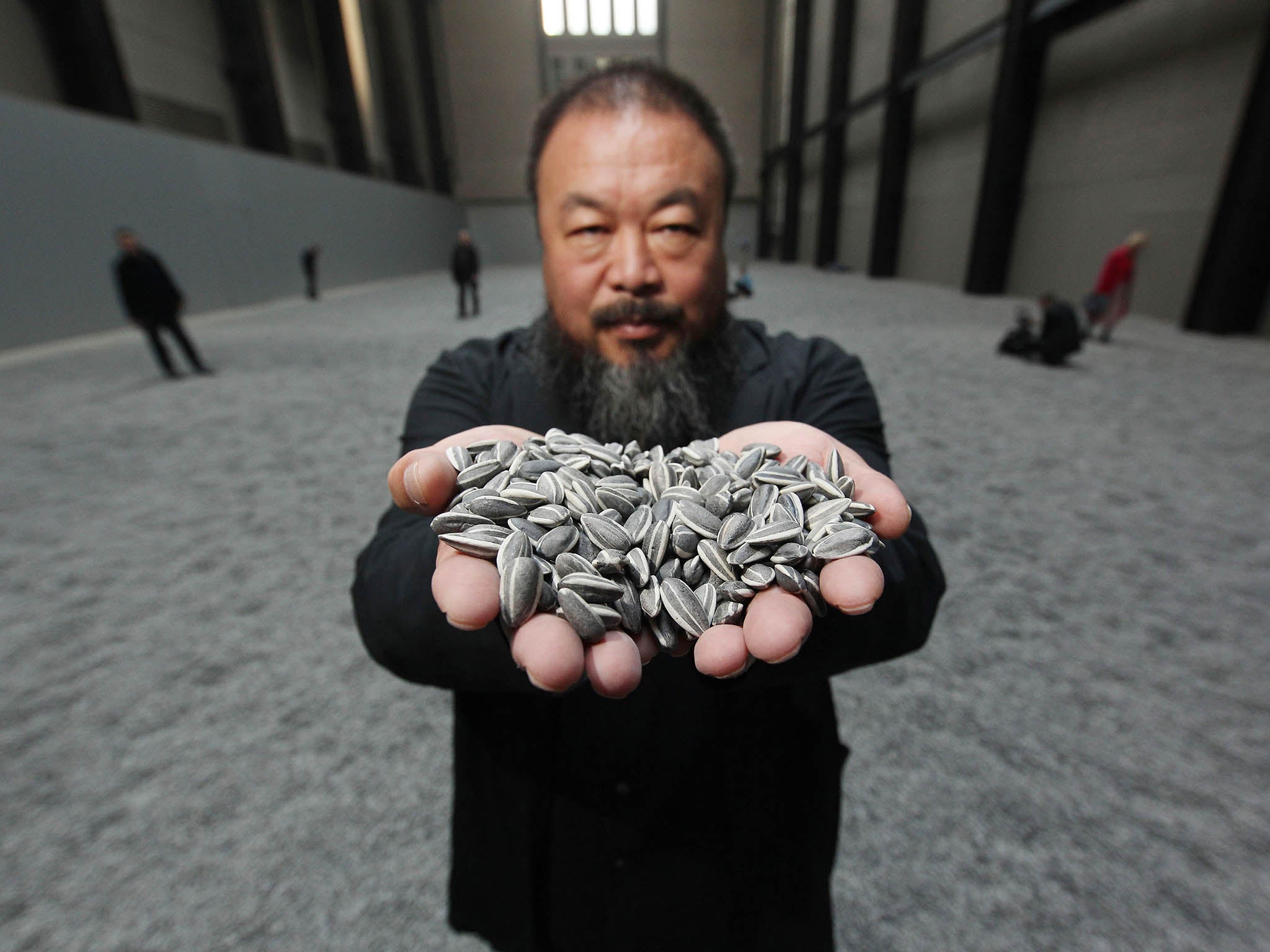 Chinese artist Ai Weiwei is still best known in Britain for filling the turbine hall of Tate Modern with millions of “sunflower seeds” for a 2010 exhibition (Getty)