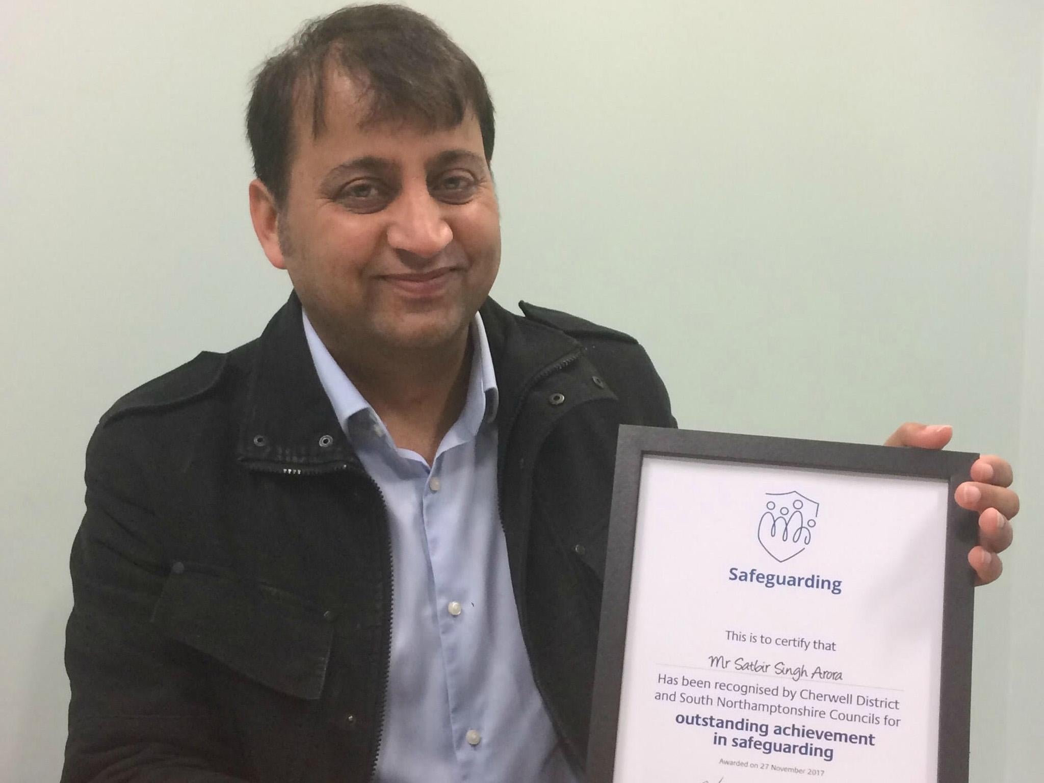 Satbir Arora was presented with a certificate of outstanding achievement in safeguarding by Cherwell District Council