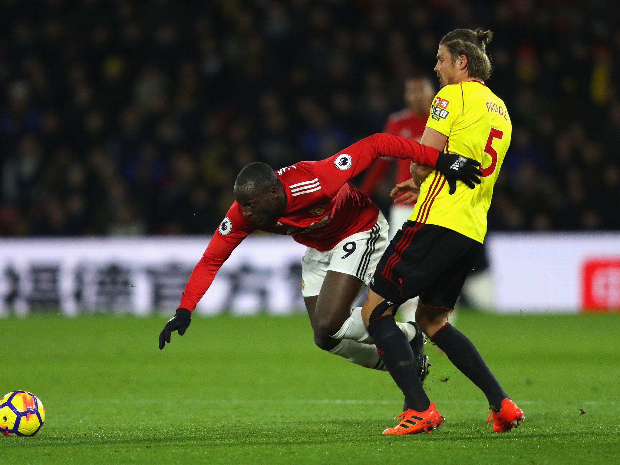 Romelu Lukaku tussles for possession with Sebastian Prodl