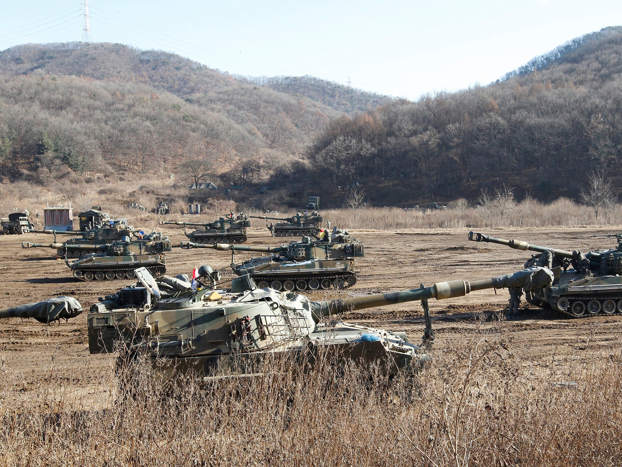 The South Korean army's K-55 self-propelled howitzers take positions during military exercises in Paju