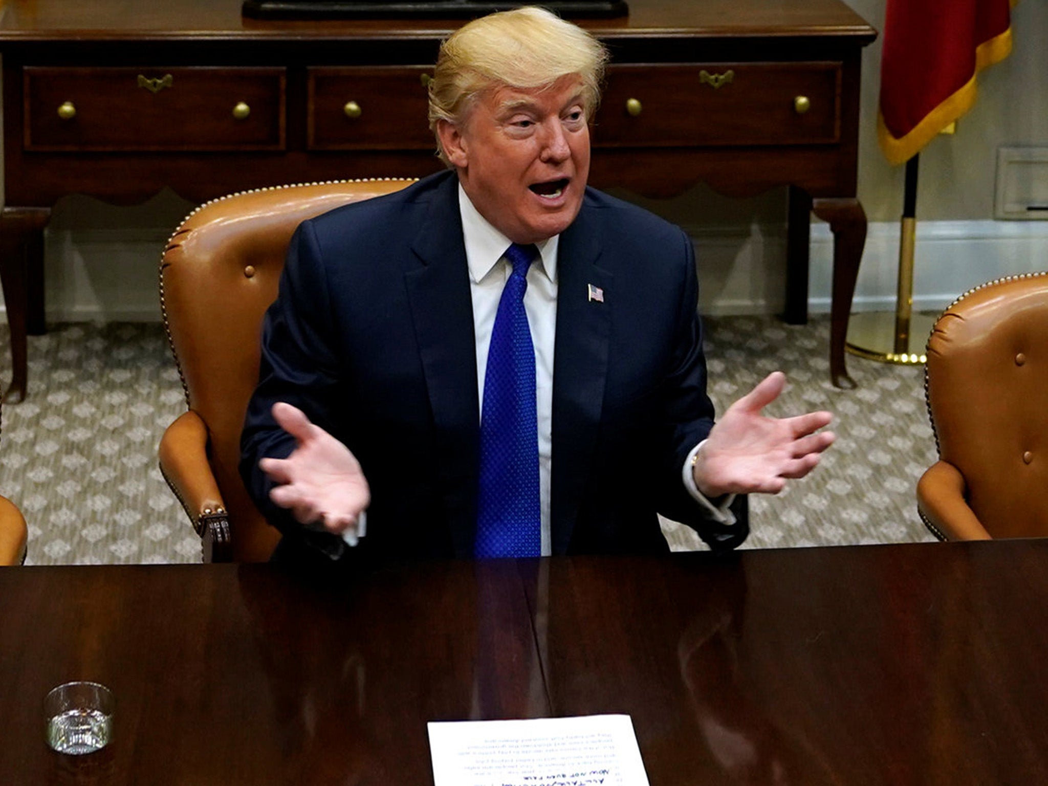 President Donald Trump speaks with reporters at the White House