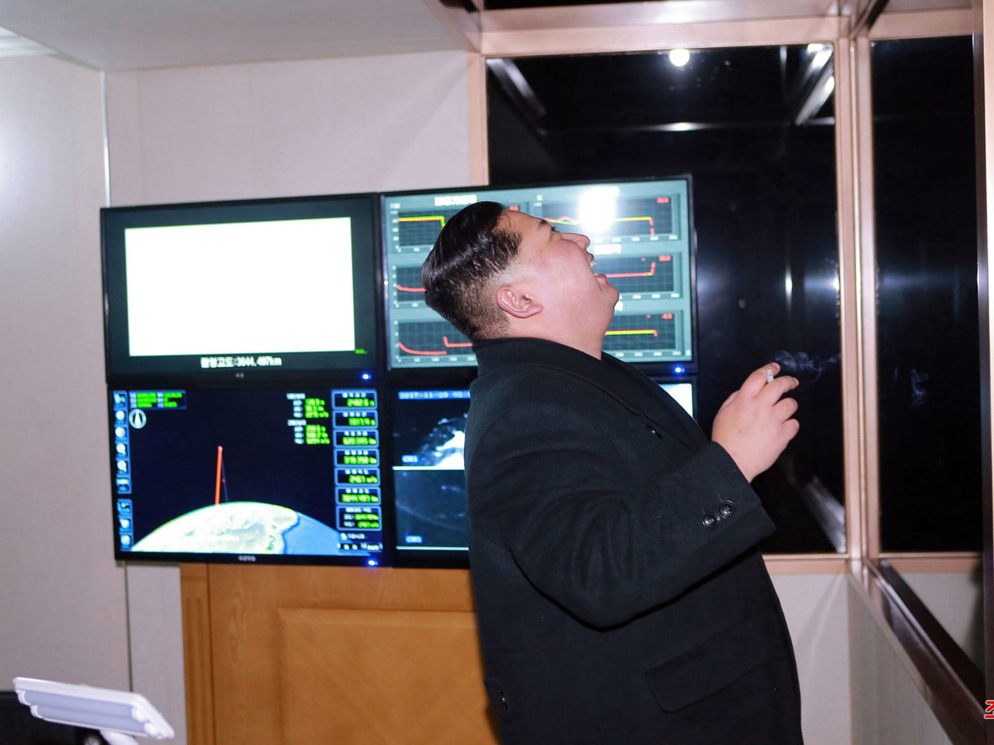 In this undated photo provided on Thursday, Nov. 30, 2017, by the North Korean government, North Korean leader Kim Jong Un inspects an intercontinental ballistic missile test in North Korea on Wednesday, Nov. 29