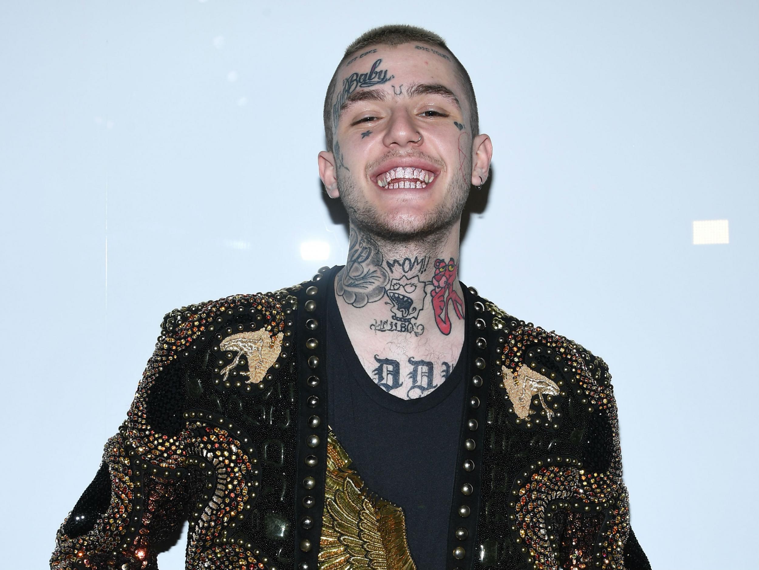 Lil Peep attends the Balmain Menswear Spring/Summer 2018 show as part of Paris Fashion Week