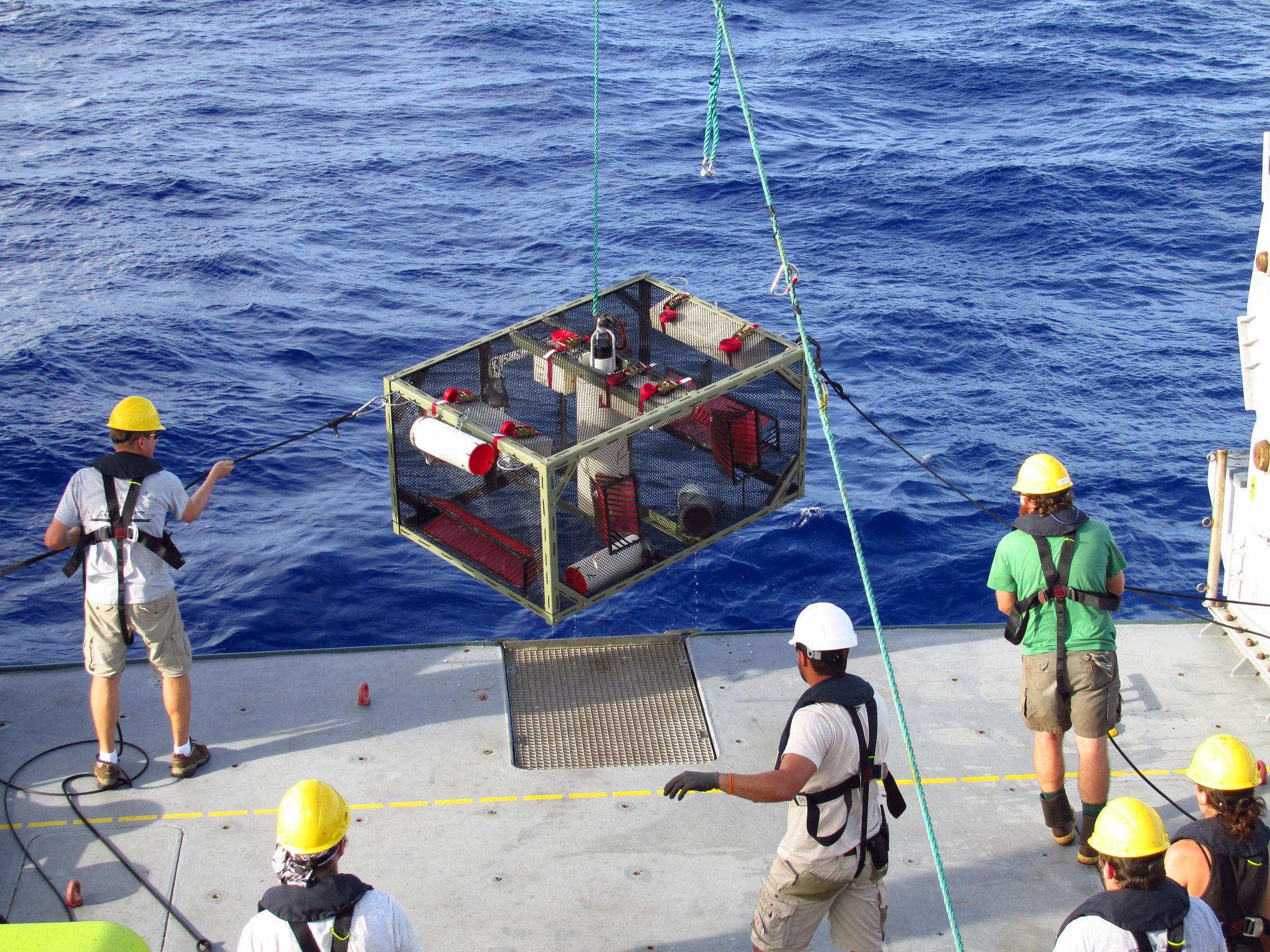 Researchers recover a camera trap used to detect deep sea life after it landed on the bottom of the Mariana Trench. It can take four hours for these traps to sink to the bottom