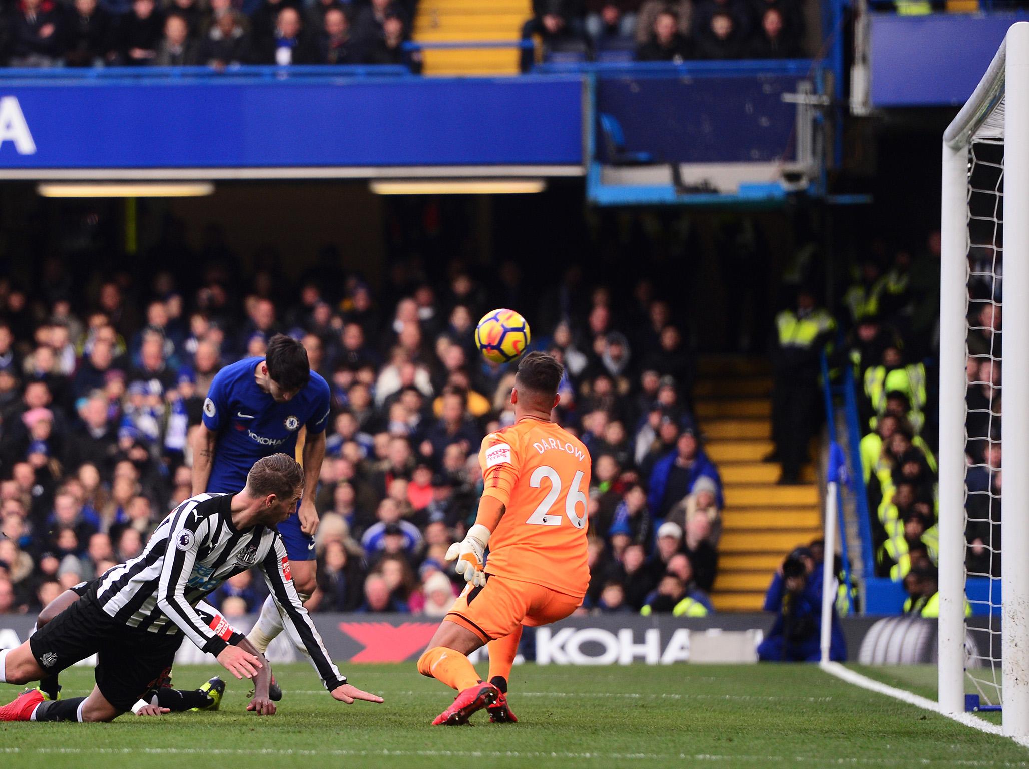 Alvaro Morata stoops to put Chelsea in front against Newcastle