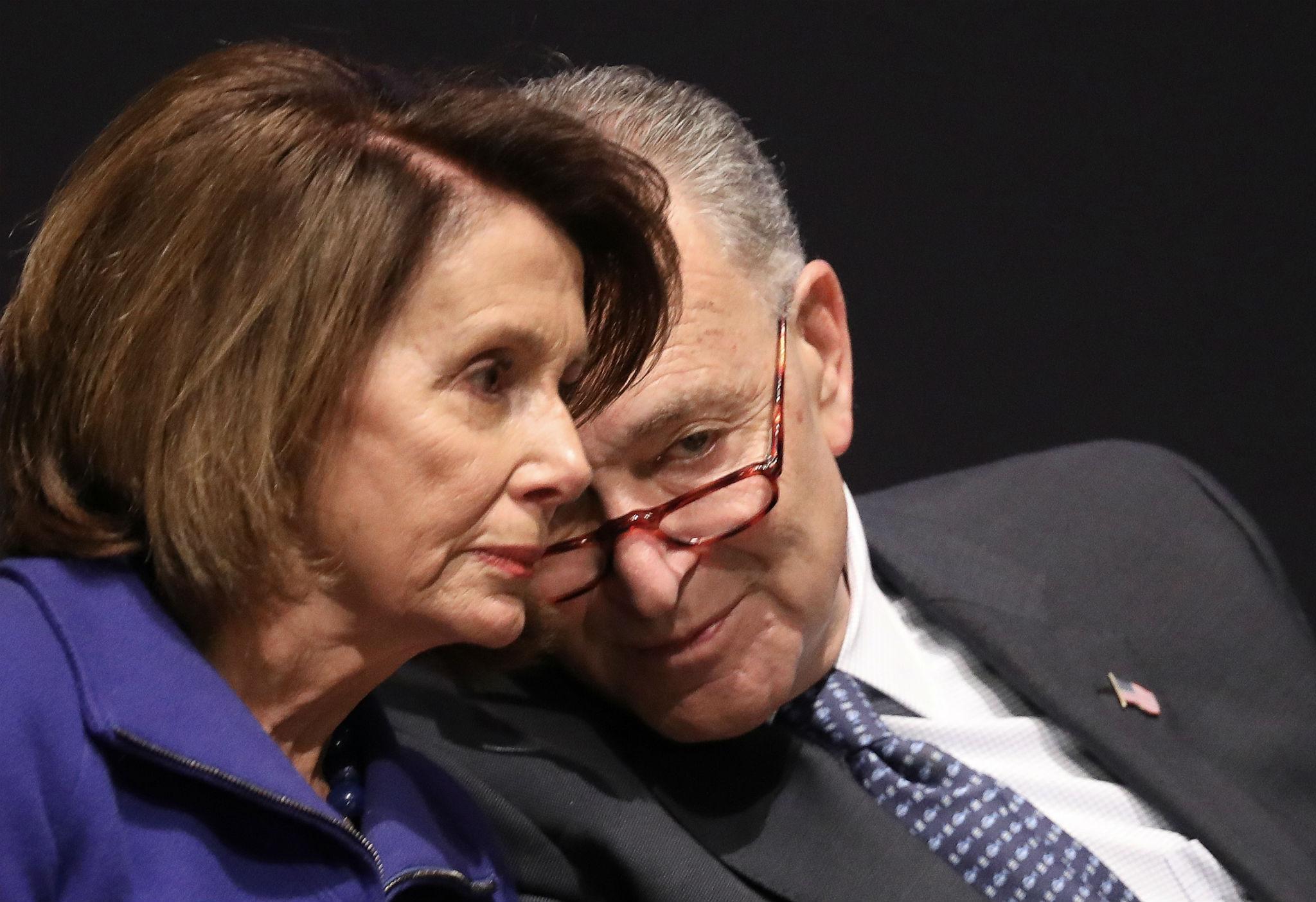 Senate Minority Leader Chuck Schumer speaks with House Minority Leader Nancy Pelosi (Photo by Win McNamee/Getty Images)