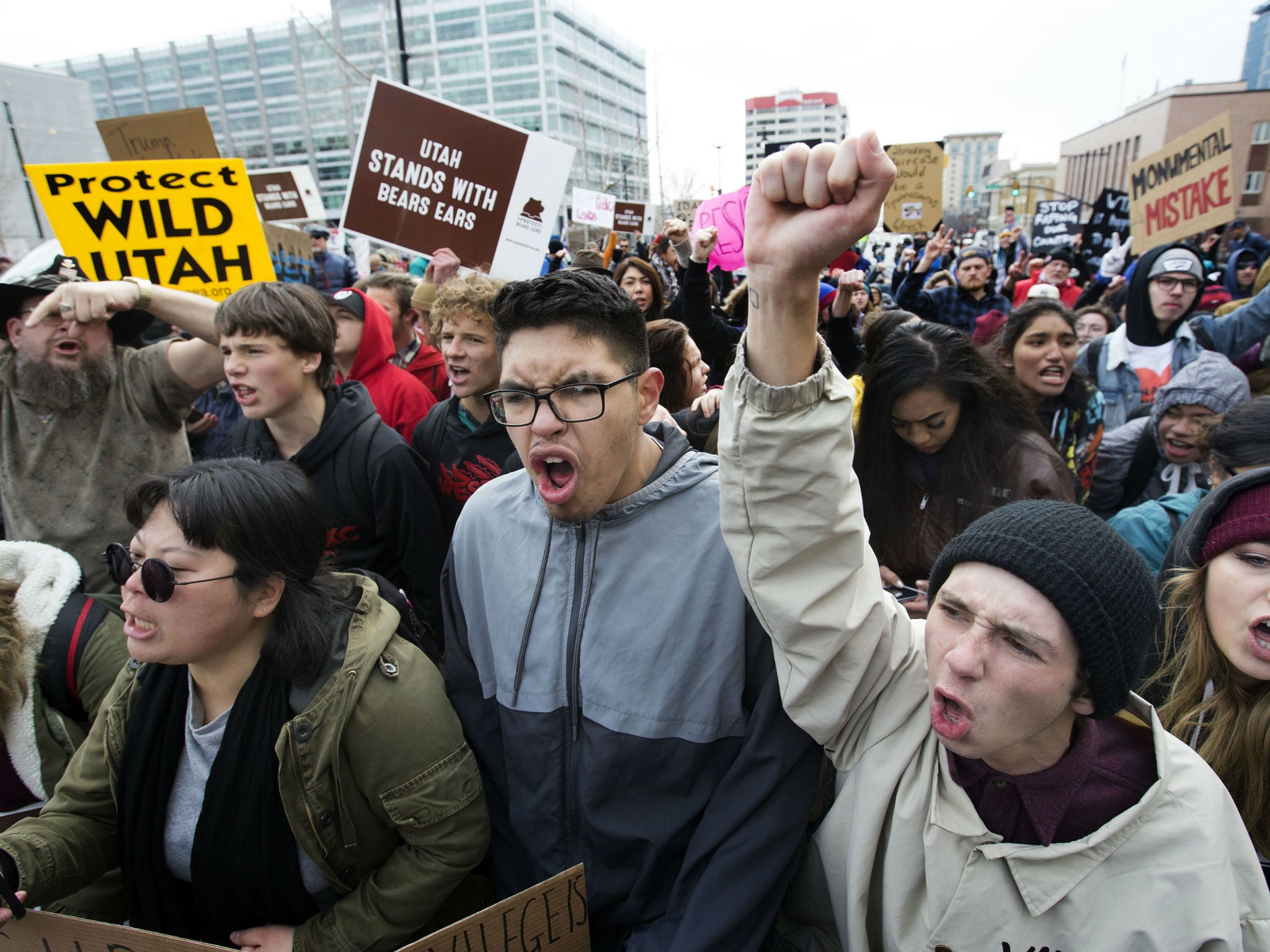 Protesters yell at police officers during President Donald Trump's announcement to eliminate vast portions of Utah's Bears Ears and Grand Staircase-Escalante national monuments in Salt Lake City, Utah, on Dec. 4, 2017