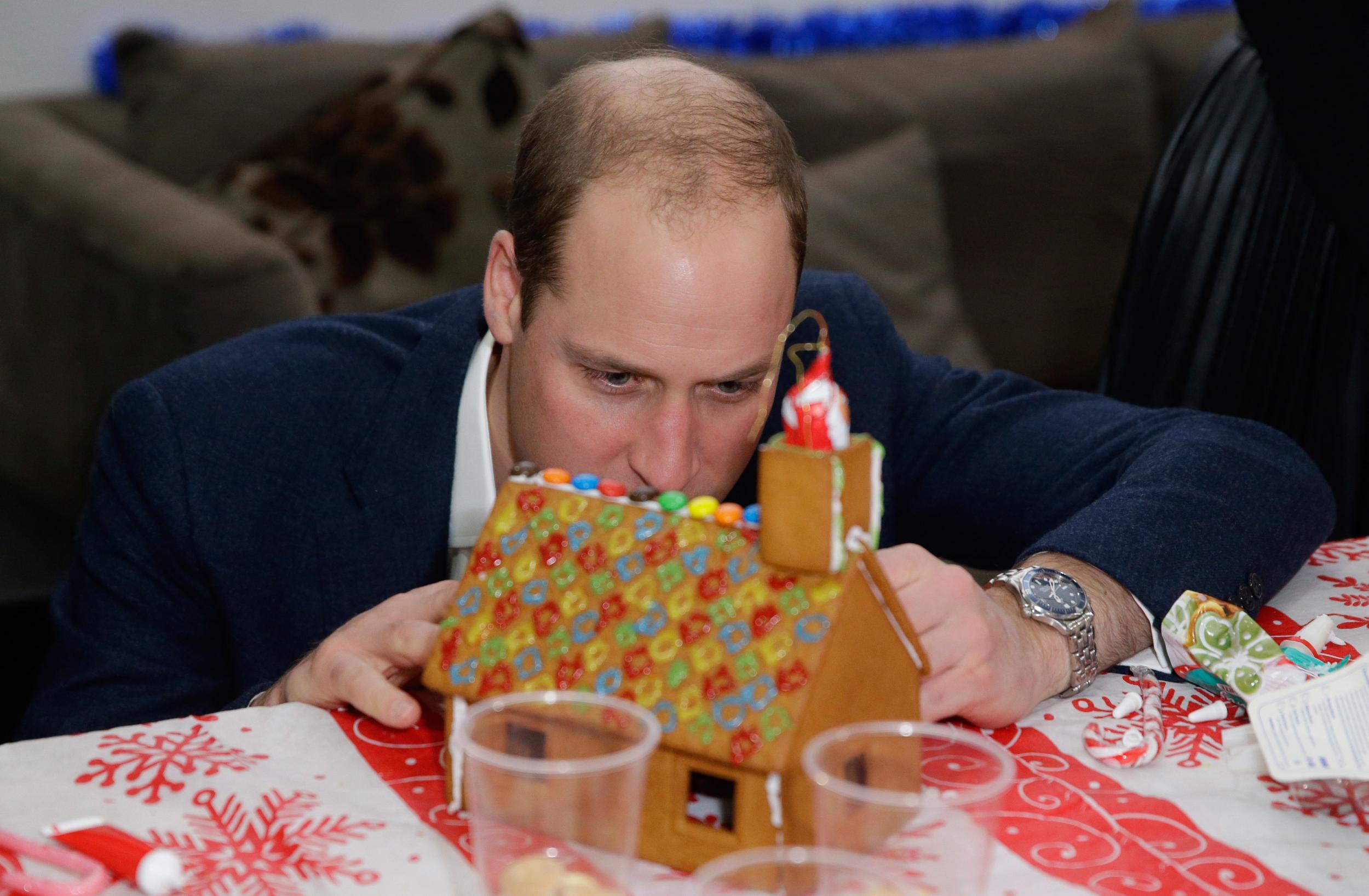 Prince William building a gingerbread house