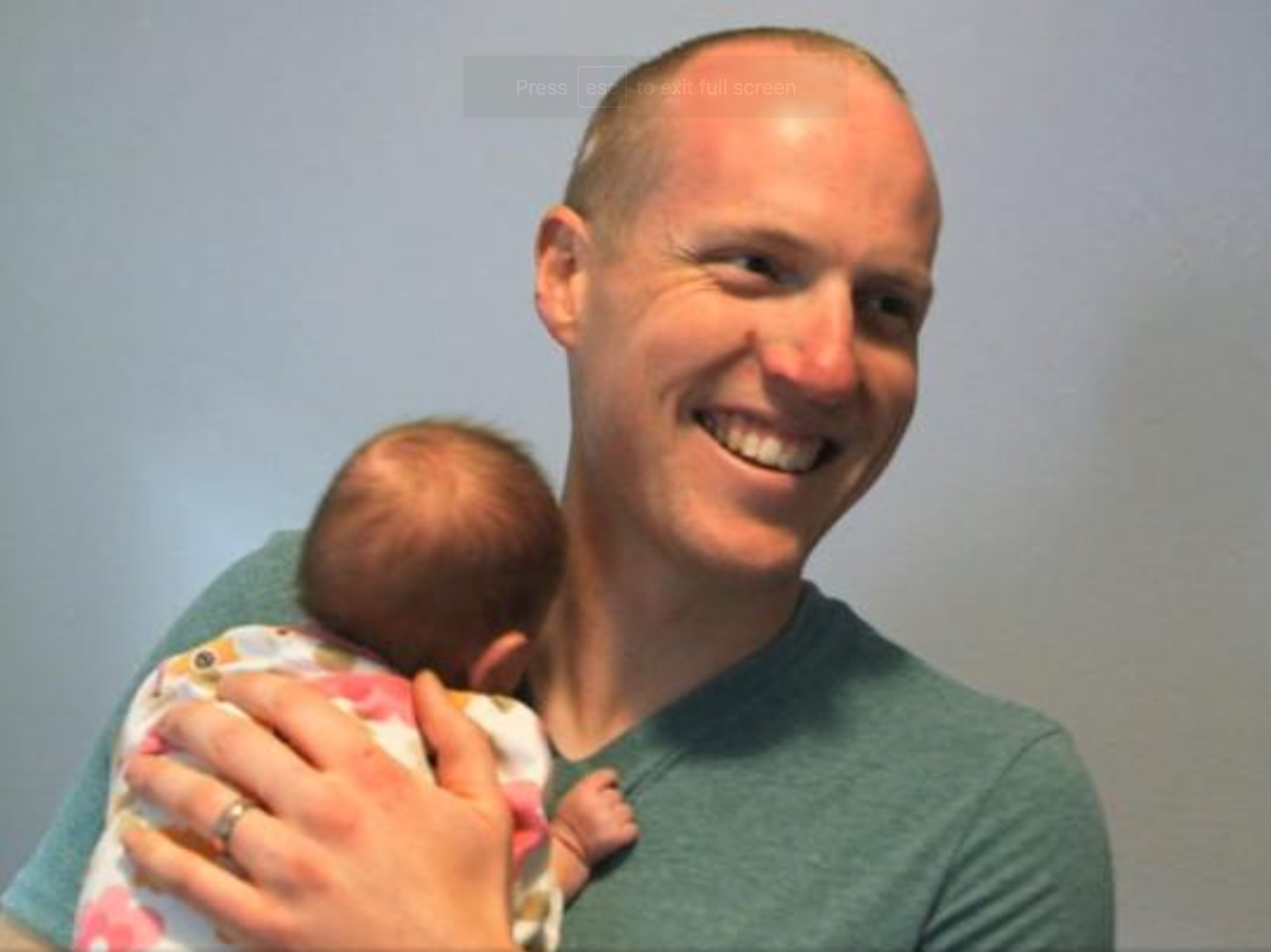 Officer Ryan Holets poses with baby Hope