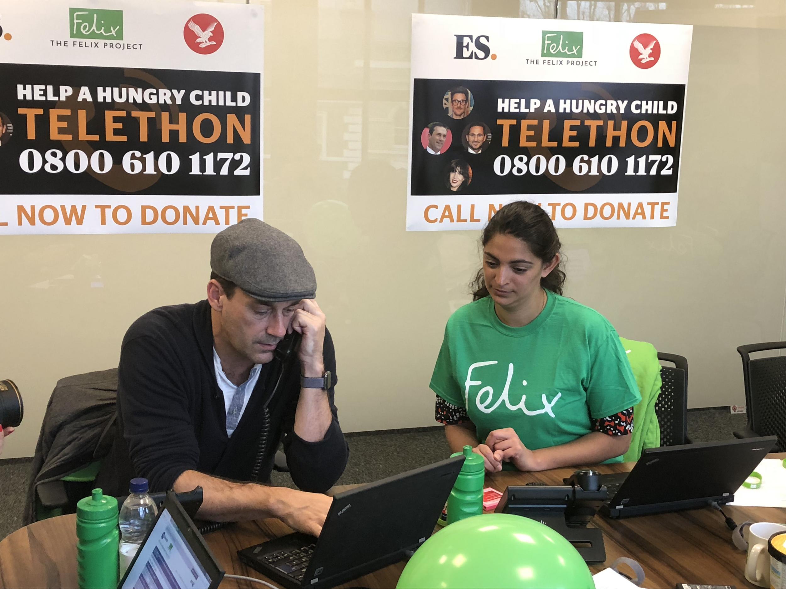 Jon Hamm answering calls in today's Christmas appeal telethon