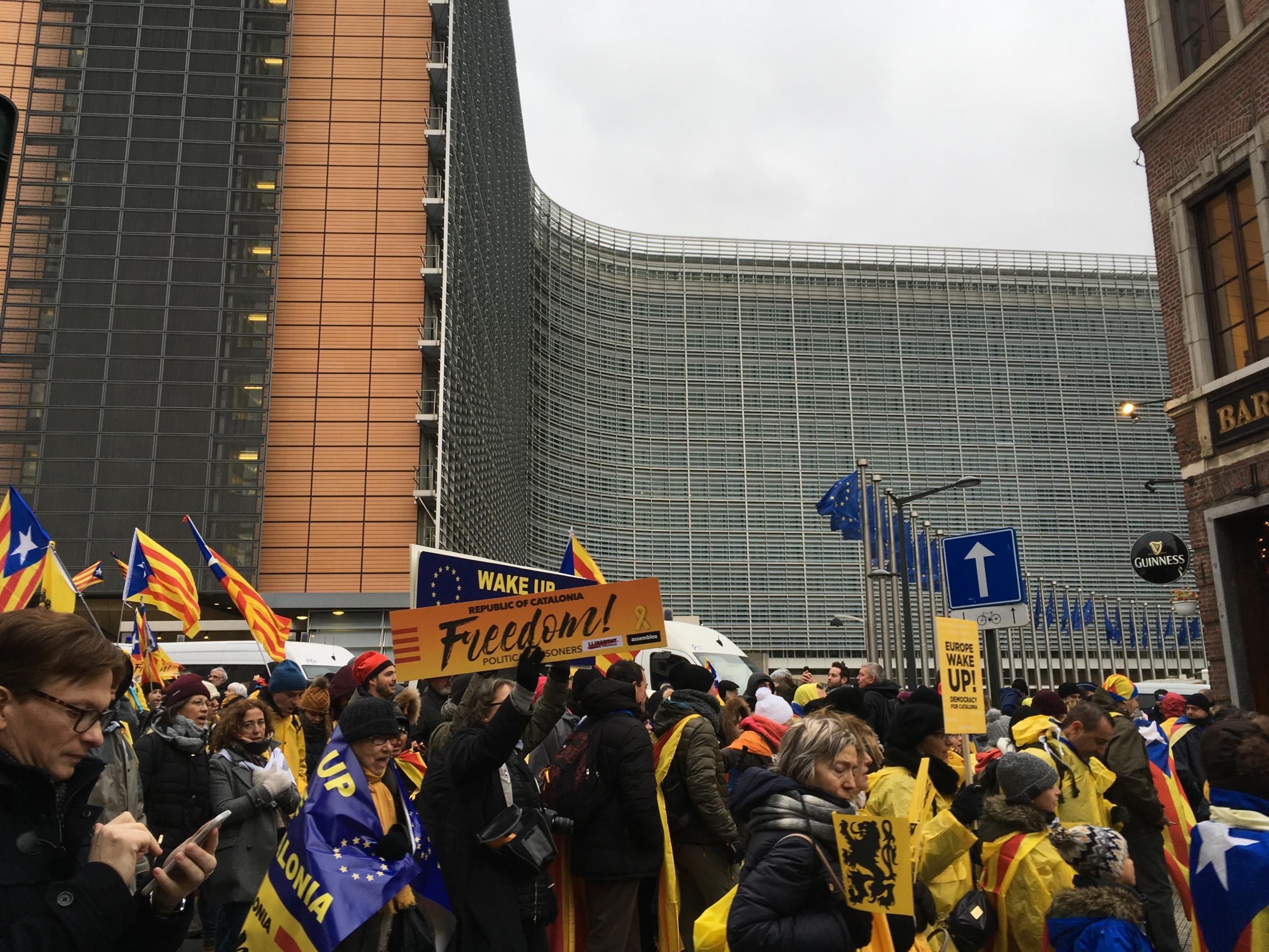 Pro-Catalan independence protesters march past the Berlaymont building, headquarters of the European Commission