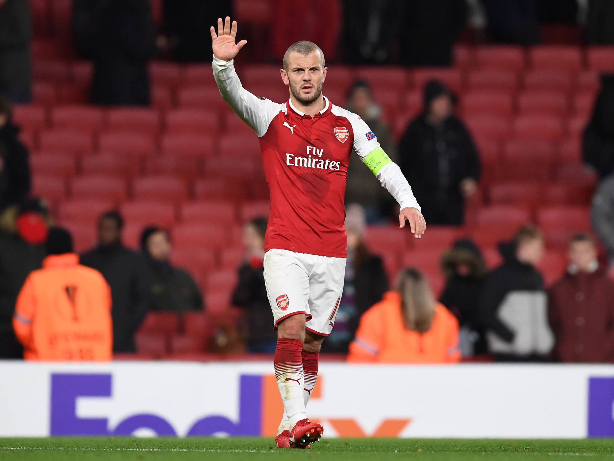 Jack Wilshere waves to a thin home crown after Arsenal's 6-0 victory over BATE Borisov