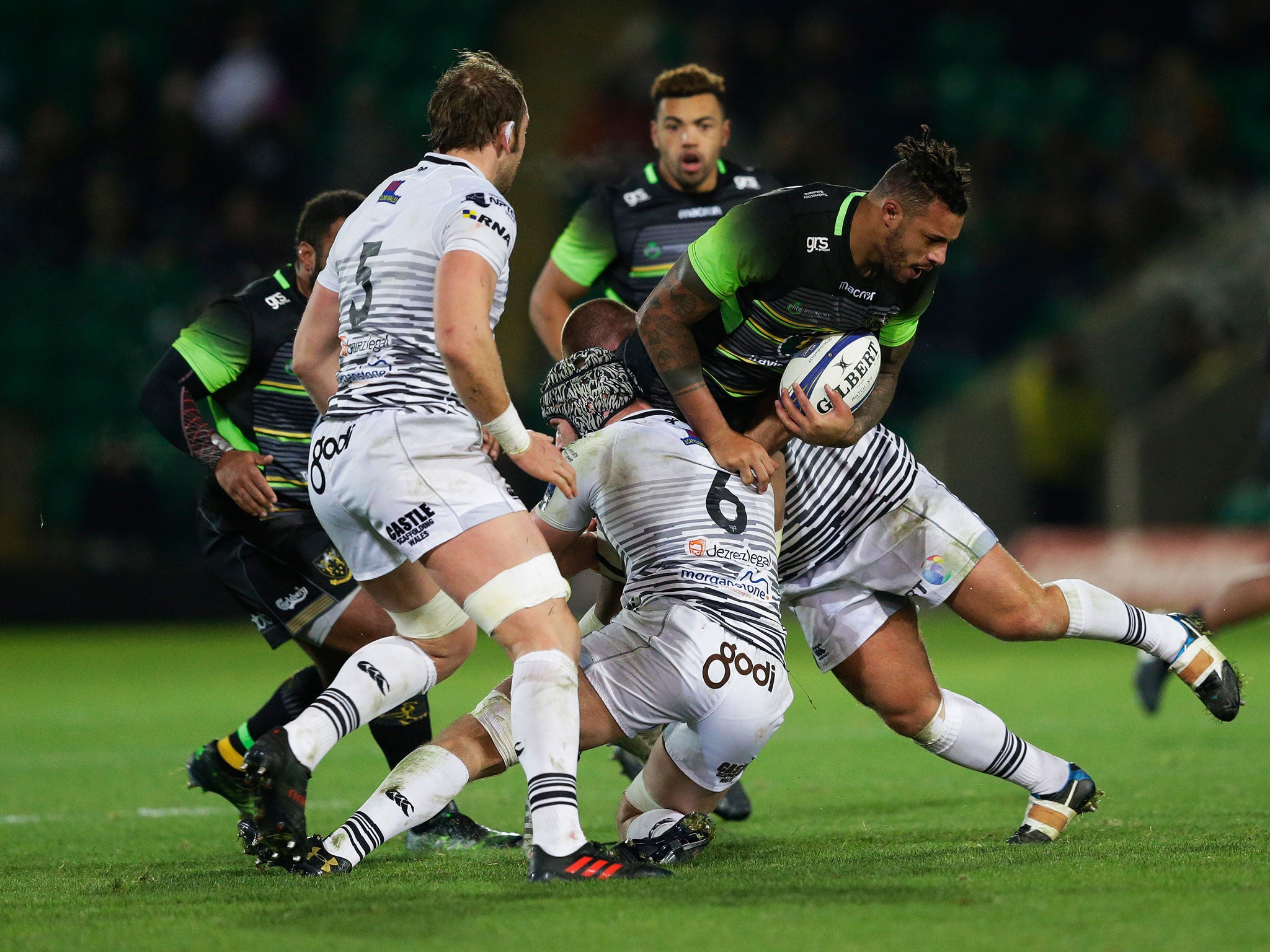 Courtney Lawes is brought down by Dan Lydiate