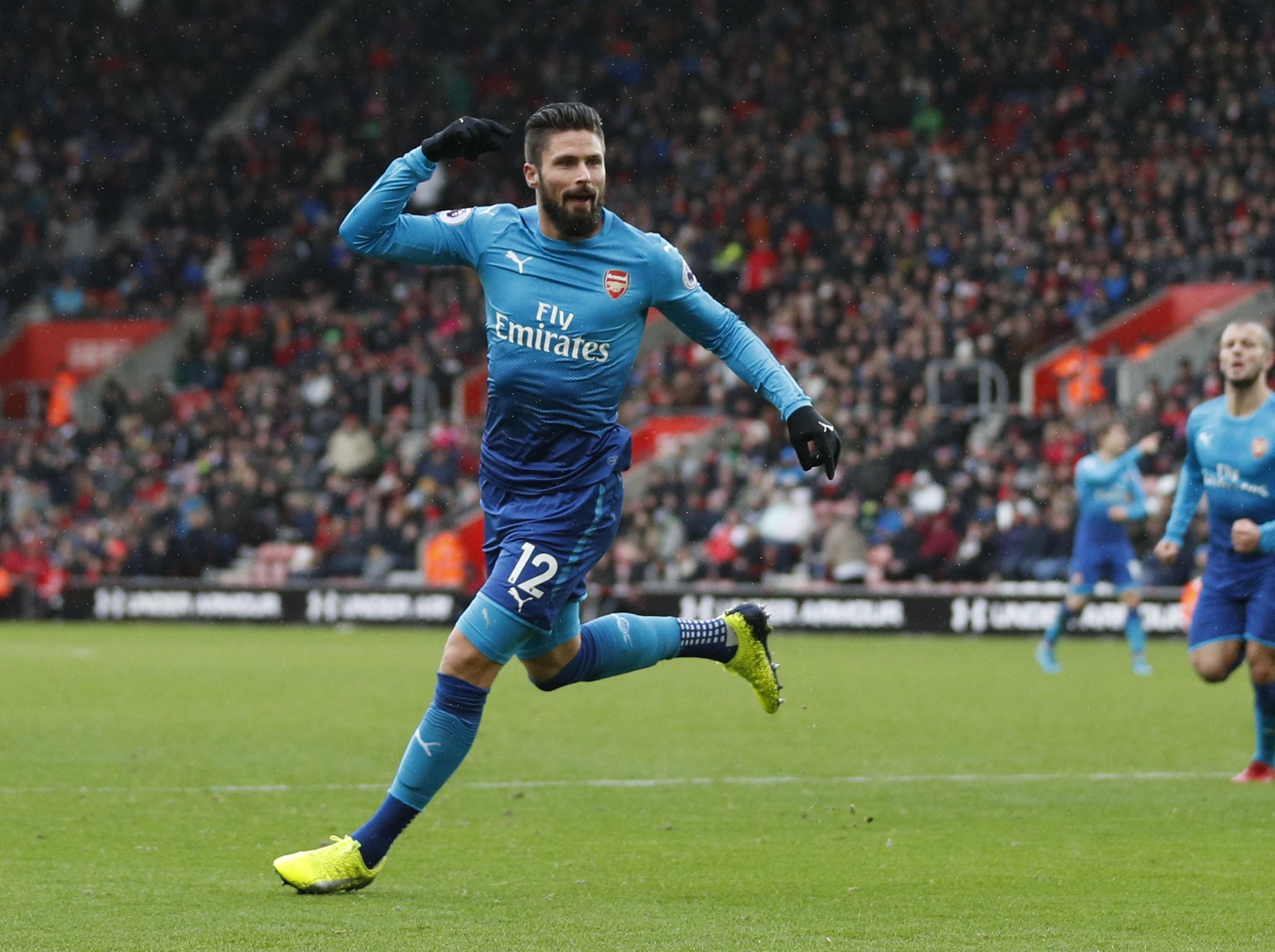 Giroud wheels away in celebration after scoring late on