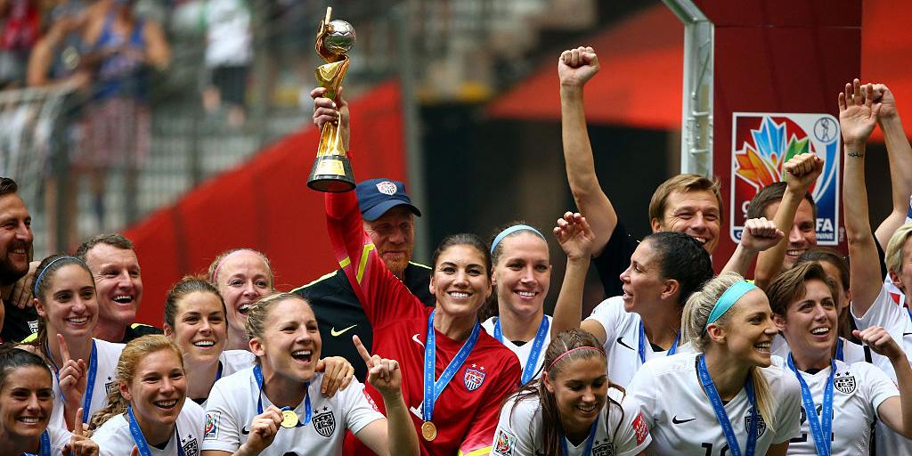 US Goalkeeper Hope Solo holds the World Cup trophy (Getty)