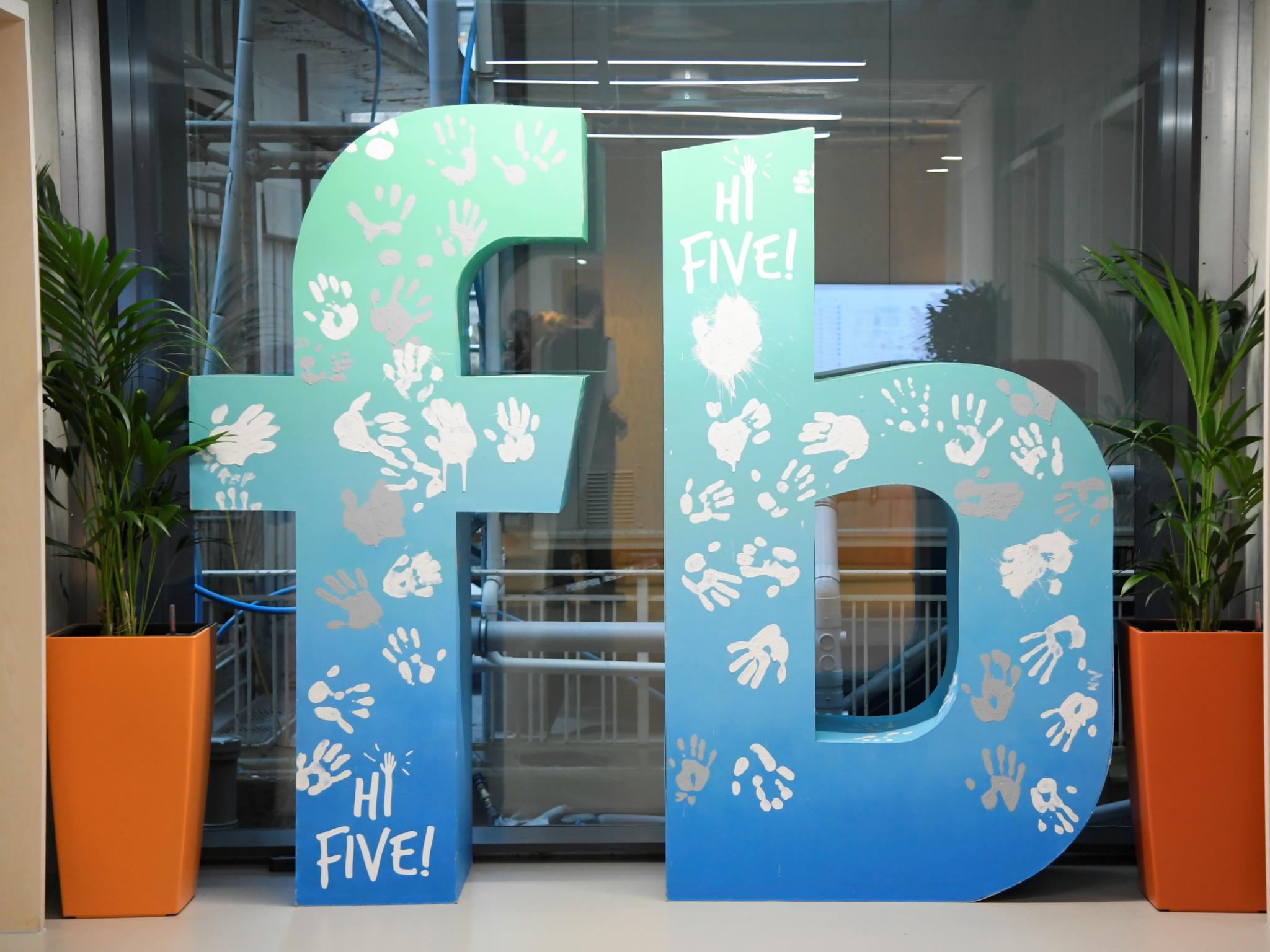 A large logo is seen at Facebook's headquarters in London, Britain, December 4, 2017