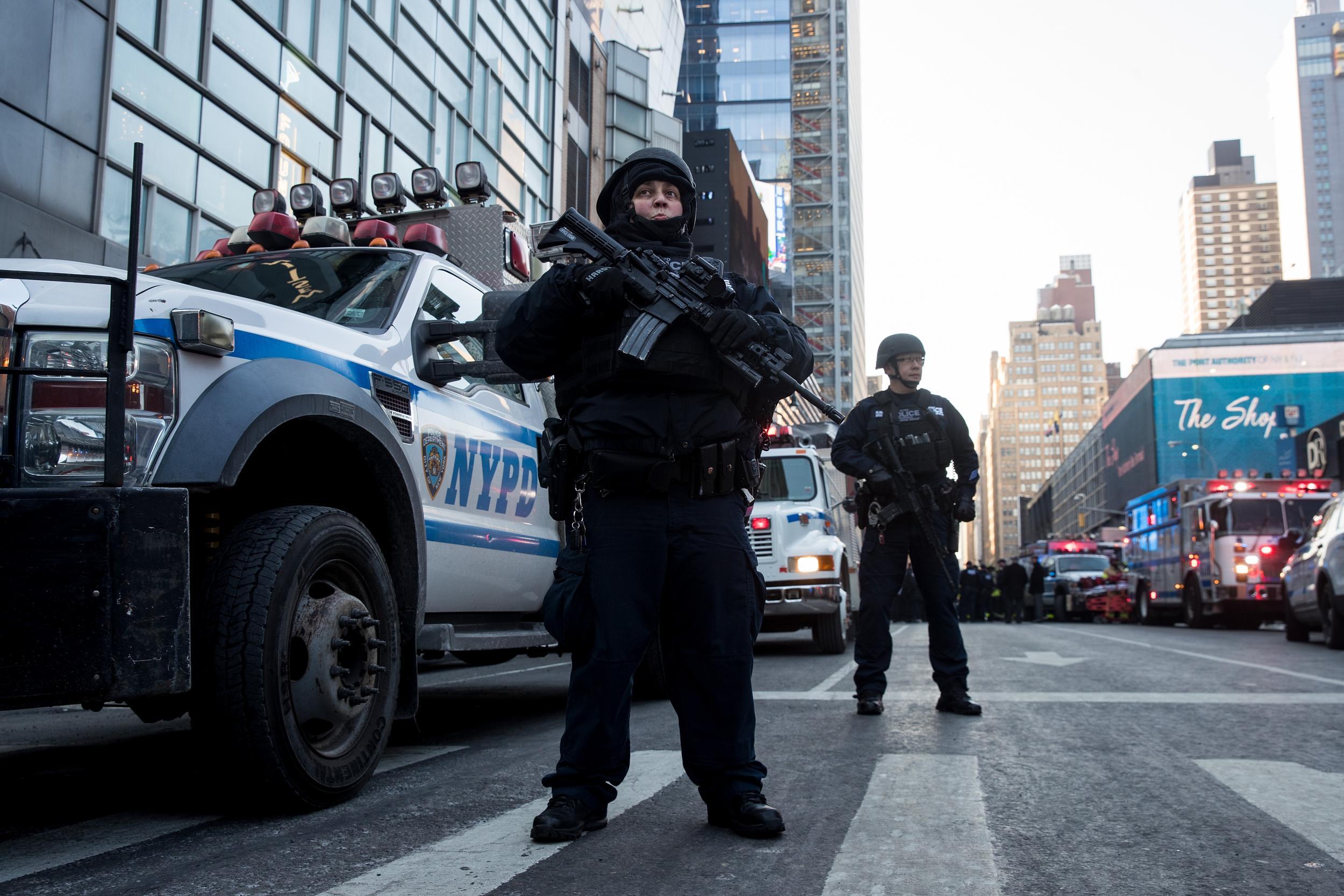 A New York City Police Department officer stands guard near the New York Port Authority Bus Terminal