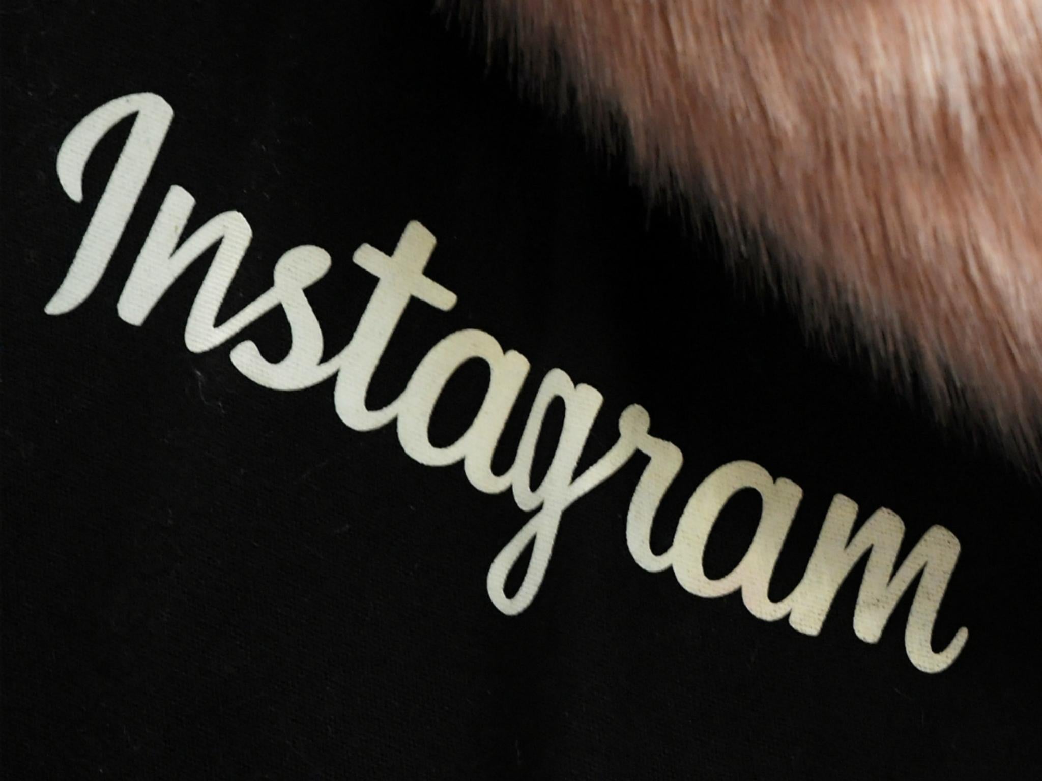 A woman carries an Instagram branded bag at Facebook's headquarters in London, Britain, December 4, 2017