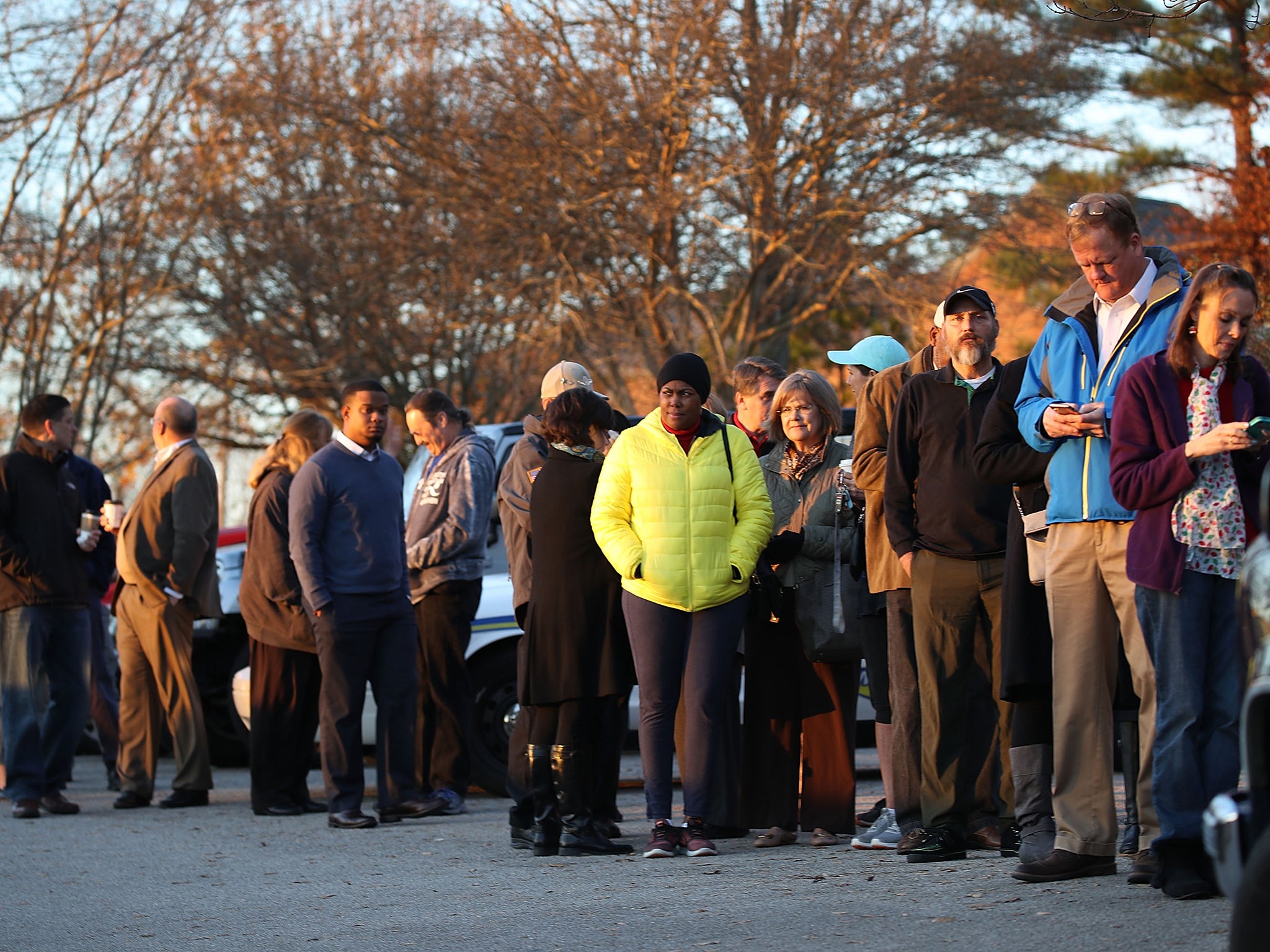 Voters wait in line to cast their ballot at a polling station setup in the St Thomas Episcopal Church on December 12, 2017 in Birmingham, Alabama. Alabama voters are casting their ballot for either Republican Roy Moore or his Democratic challenger Doug Jones in a special election to decide who will replace Attorney General Jeff Sessions in the U.S. Senate. (Photo by Joe Raedle/Getty Images)