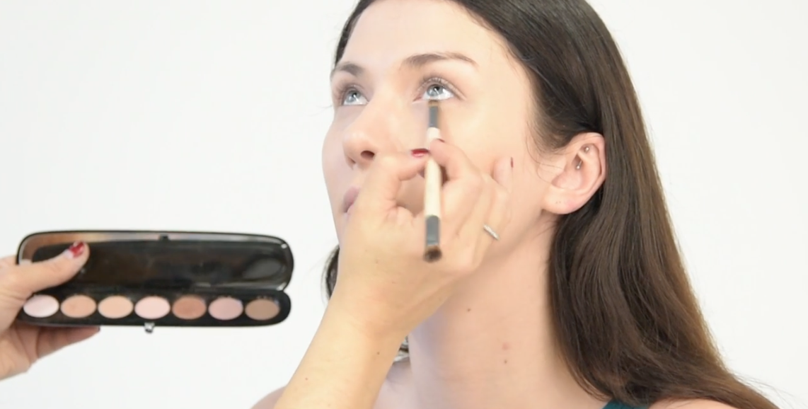 Apply a shimmer satin eyeshadow in a brightening tone