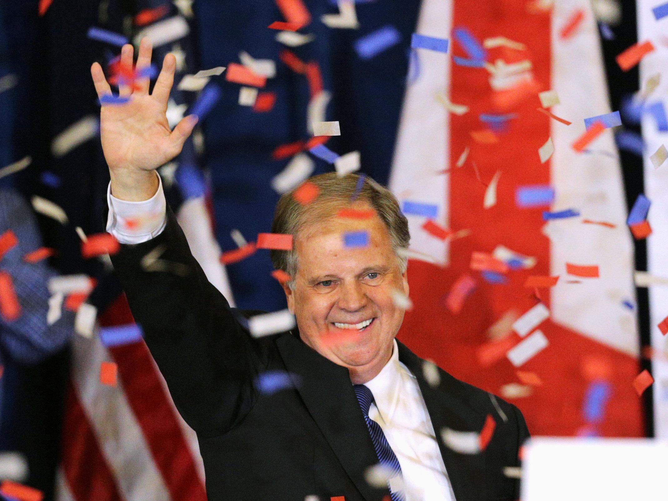 Mr Jones acknowledges supporters at the election night party in Birmingham, Alabama