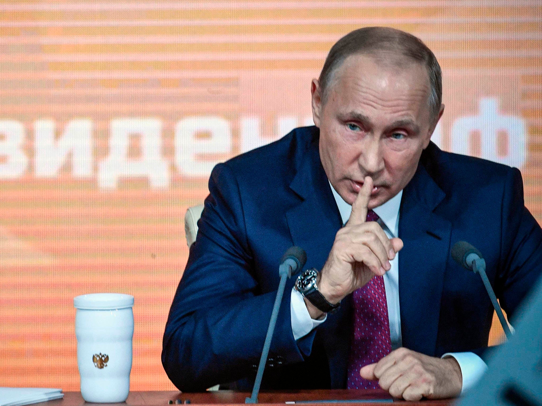 &#13;
Putin gestures to a journalist during his annual press conference &#13;