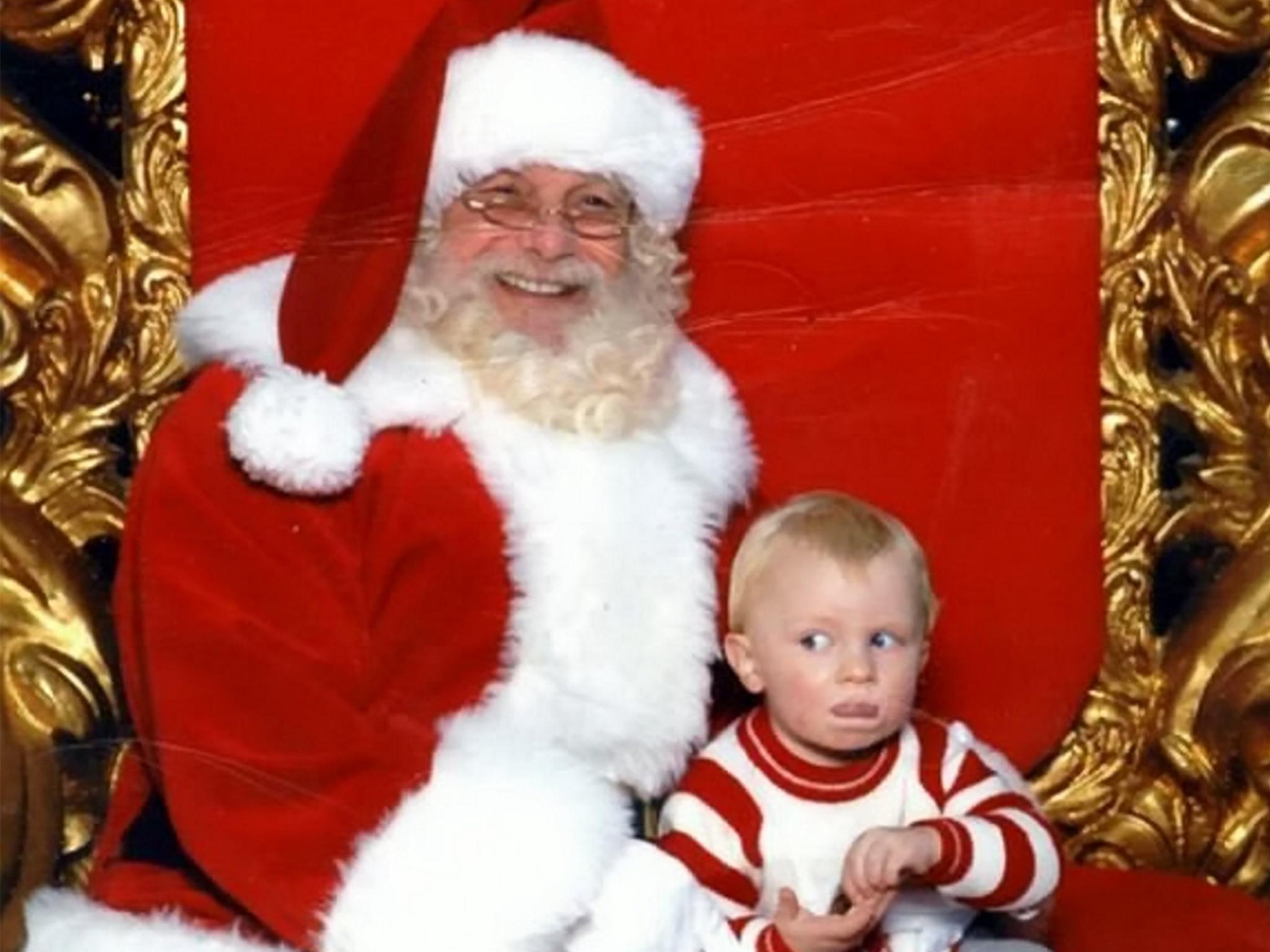 Samuel, pictured as a baby, attempts the sign language for 'help'