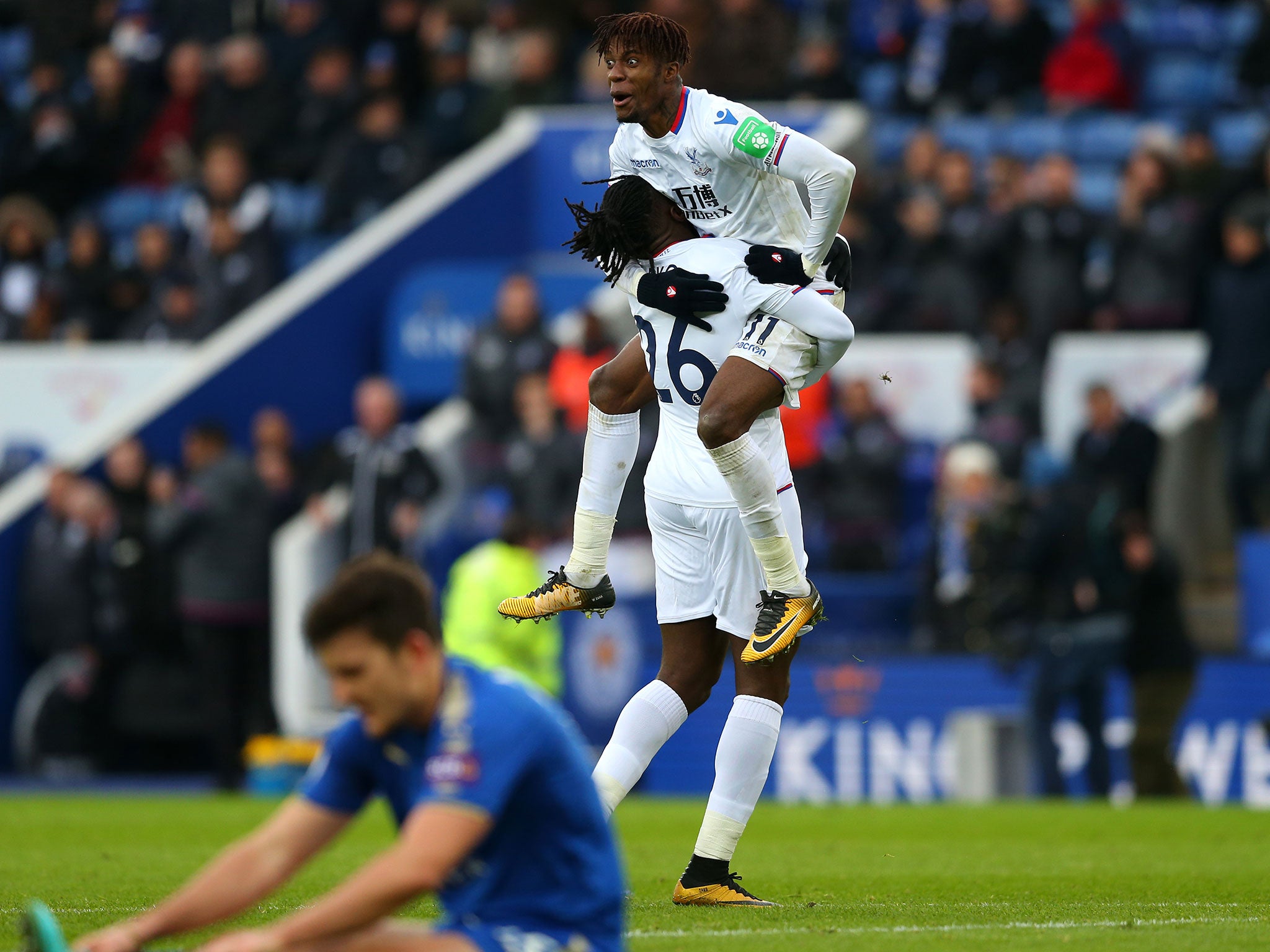 Bakary Sako celebrates with Wilfried Zaha after adding Palace's third