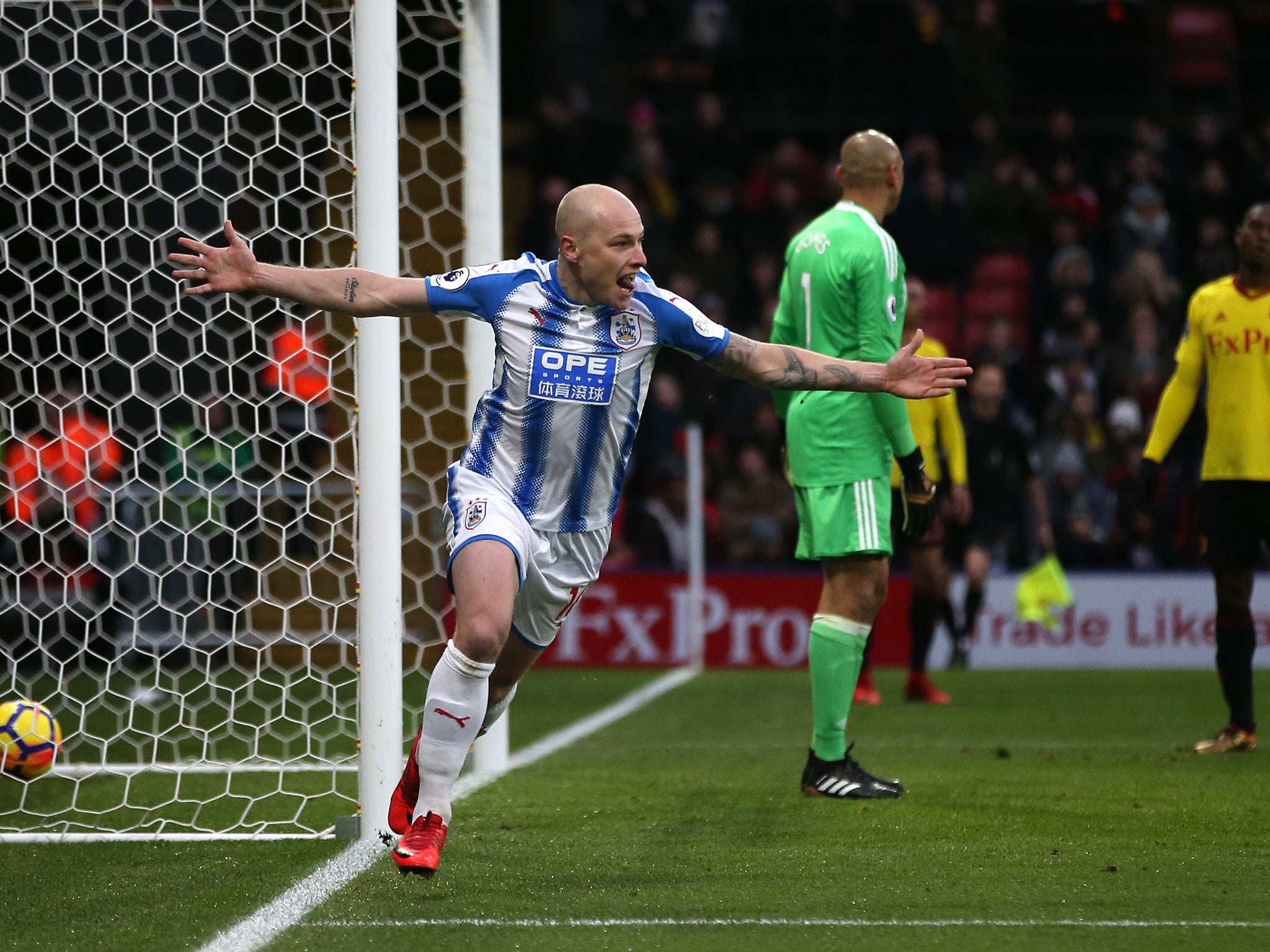 Aaron Mooy celebrates after doubling the Huddersfield lead