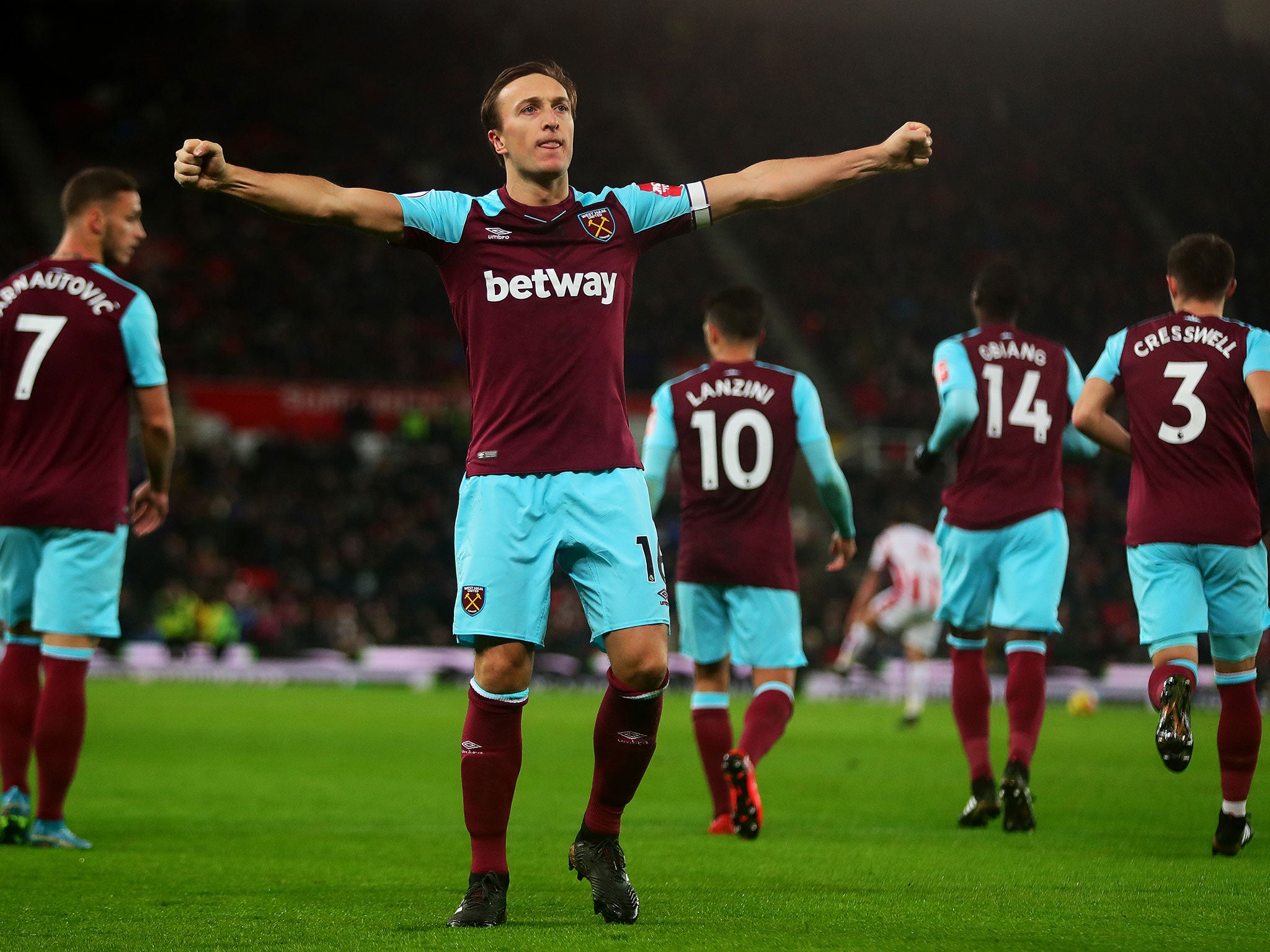 Mark Noble celebrates after converting from the spot