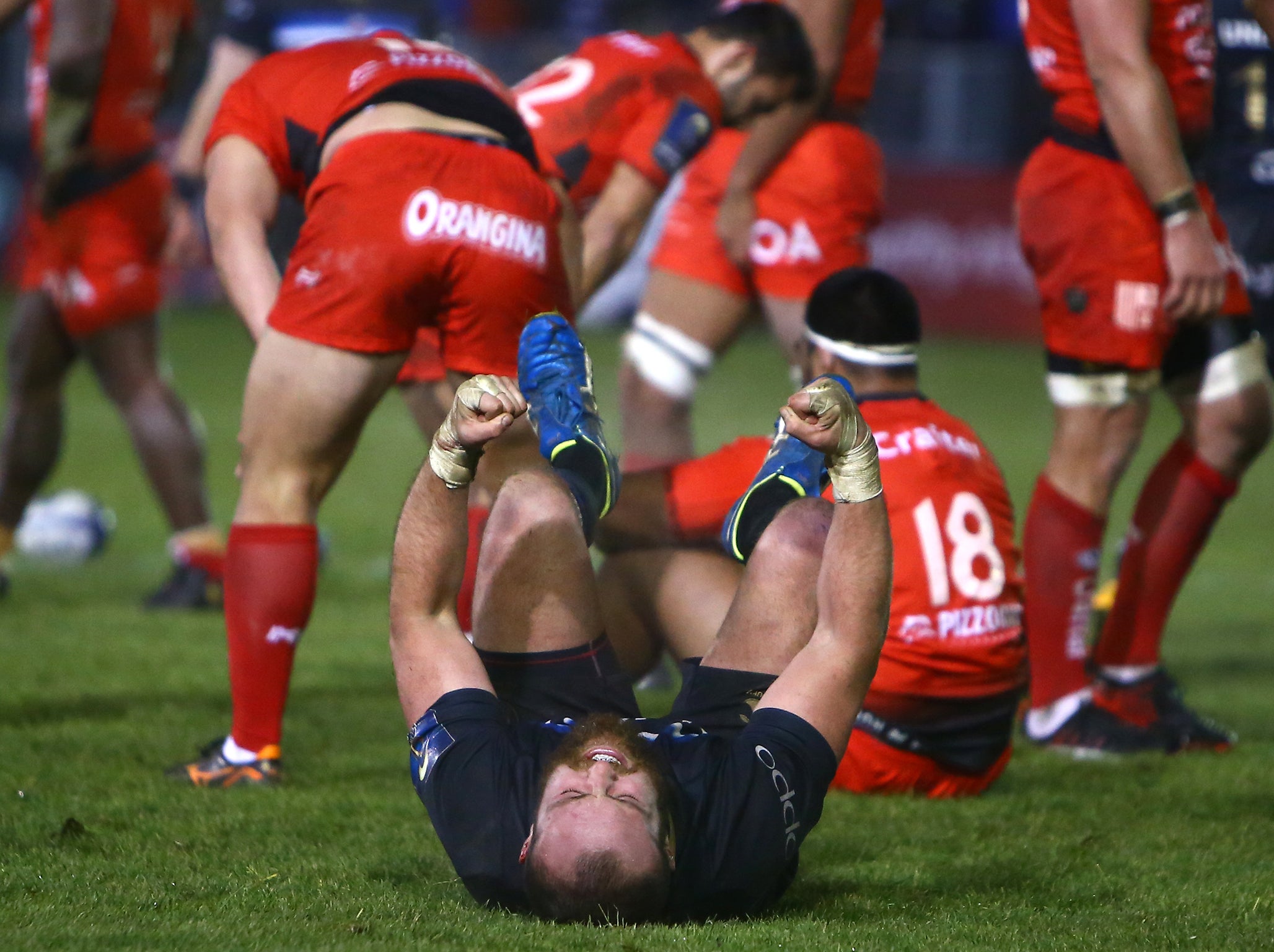 Tom Dunn falls to the floor in celebration after Bath's hard-fought win