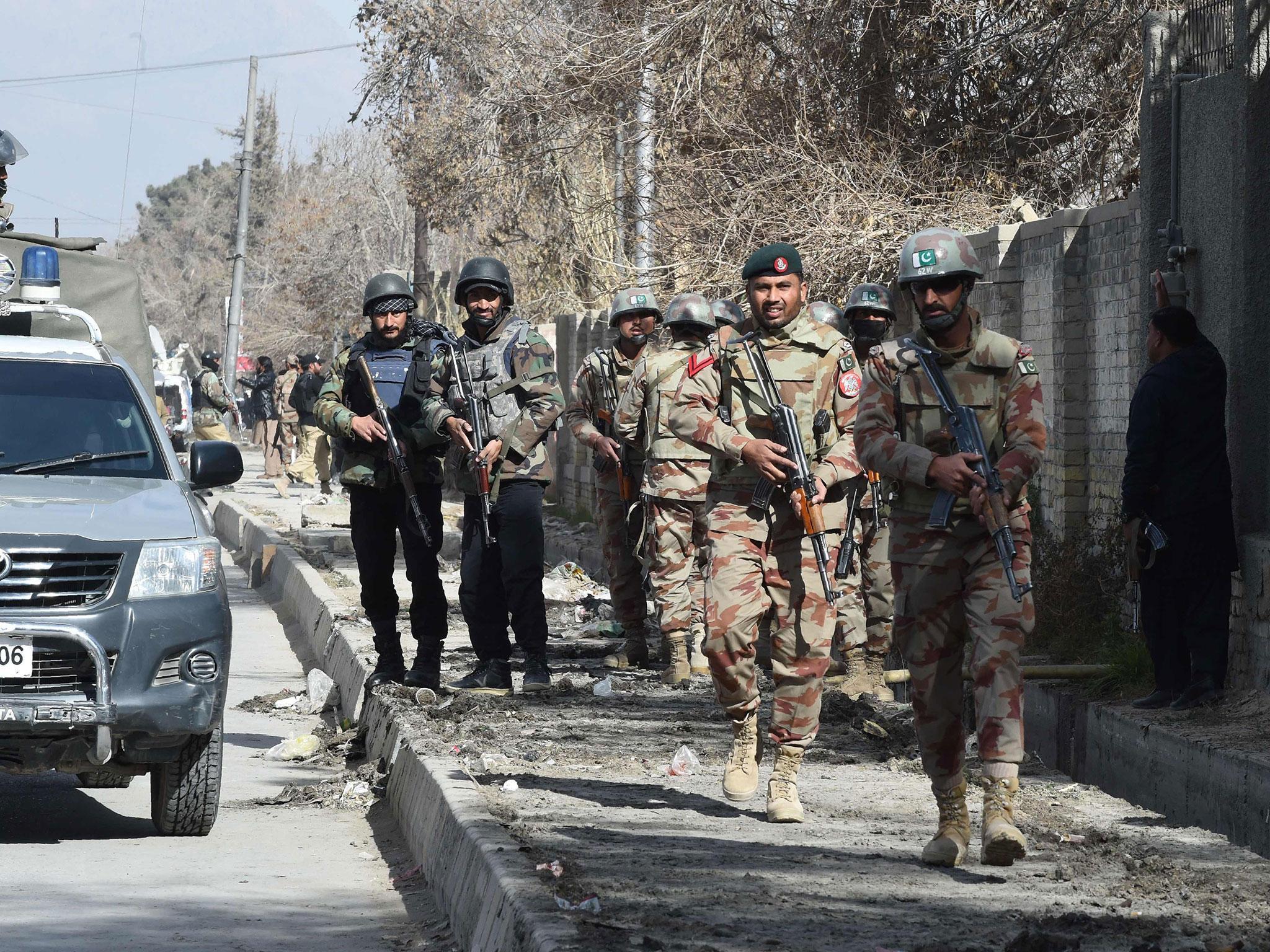 Pakistani security personnel patrol after suicide bombers attacked a Methodist church during a Sunday service in Quetta in December