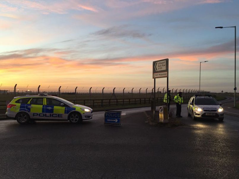 Police outside RAF Mildenhall in Suffolk, after shots were fired by US service personnel and a suspect was arrested after a disturbance