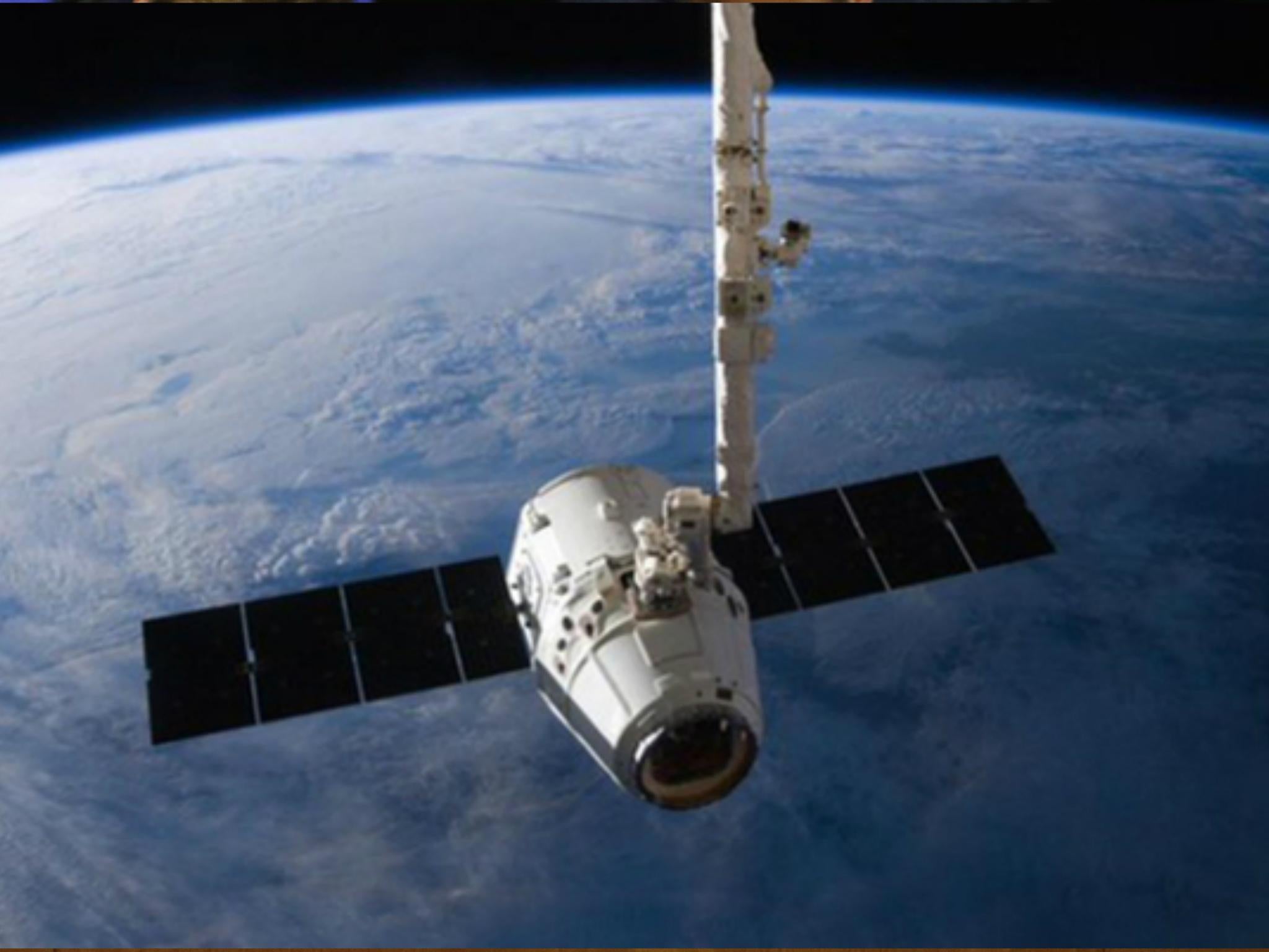 The SpaceX Dragon cargo capsule approaches the International Space Station prior to installation in this NASA picture taken 10 April 2016.